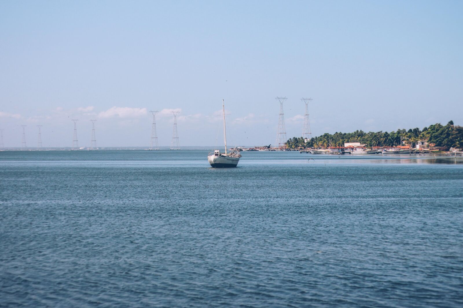 Canon EOS 60D + Canon EF 50mm F1.8 II sample photo. Blue, boat, coast, sail photography