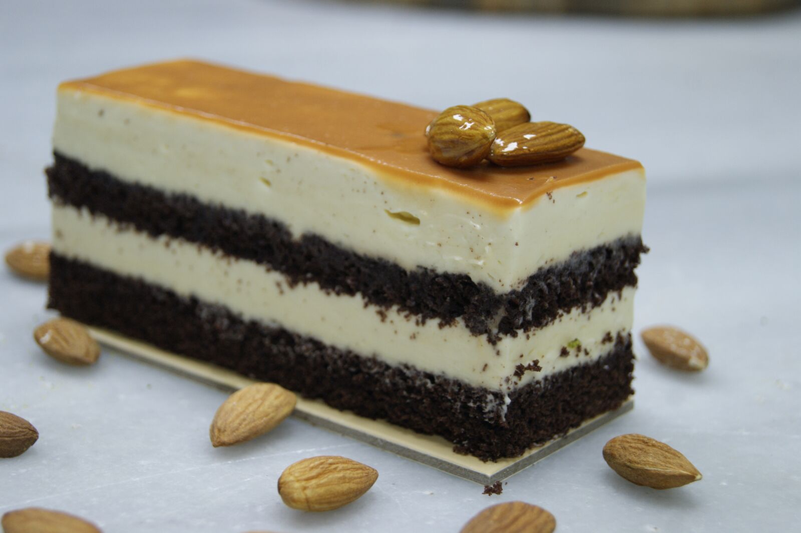 Sony Alpha DSLR-A290 sample photo. Almond, cake, piece of photography
