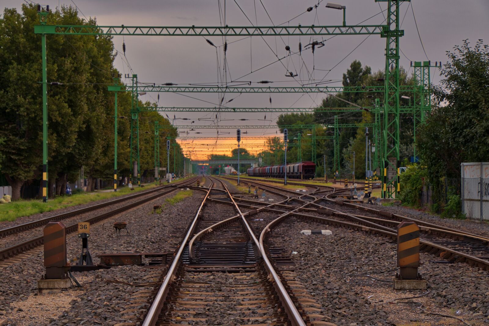 Canon EF-S 18-135mm F3.5-5.6 IS USM sample photo. Tracks, railway station, soft photography