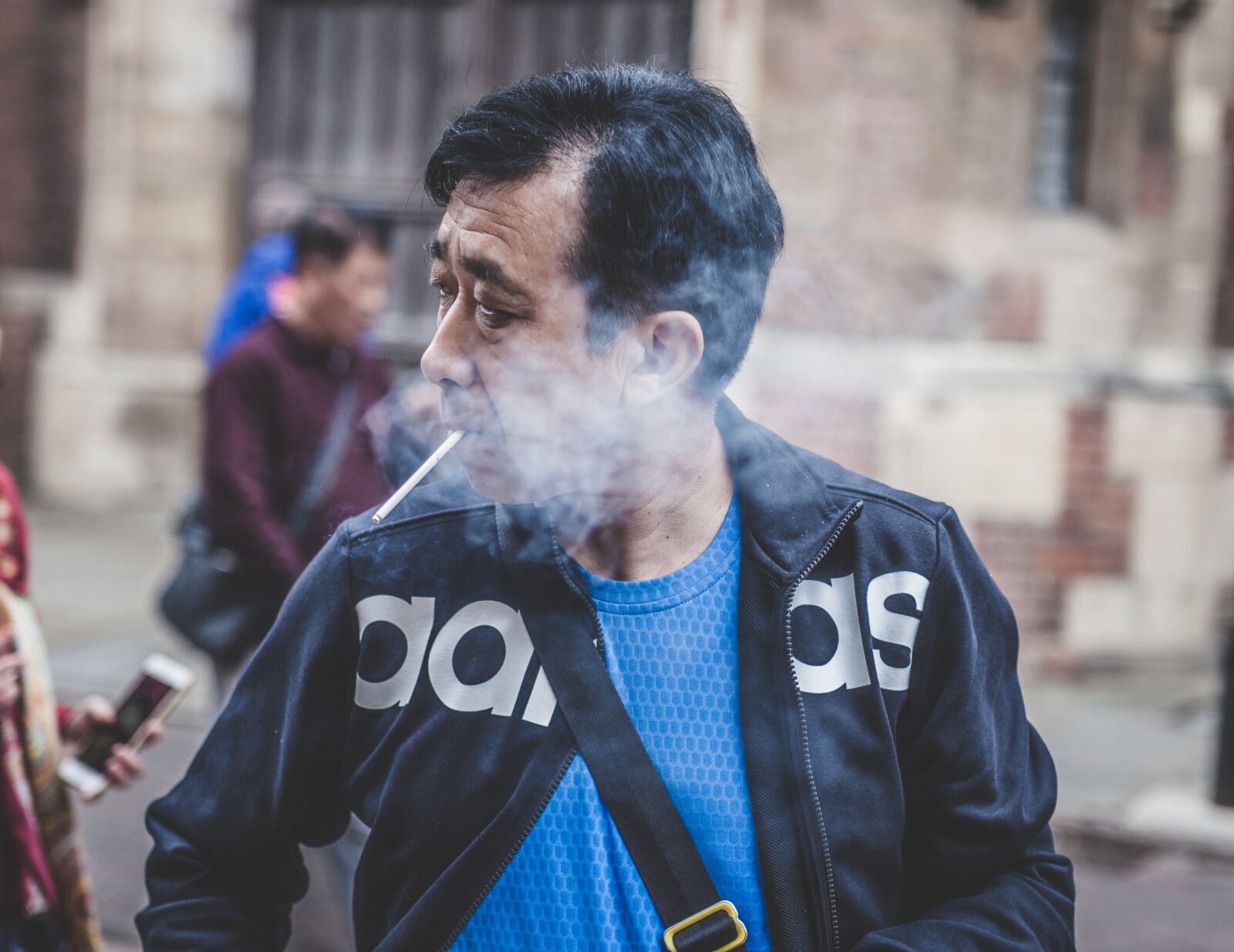Canon EF 28-70mm f/2.8L USM sample photo. Cigarette, close, up, jacket photography