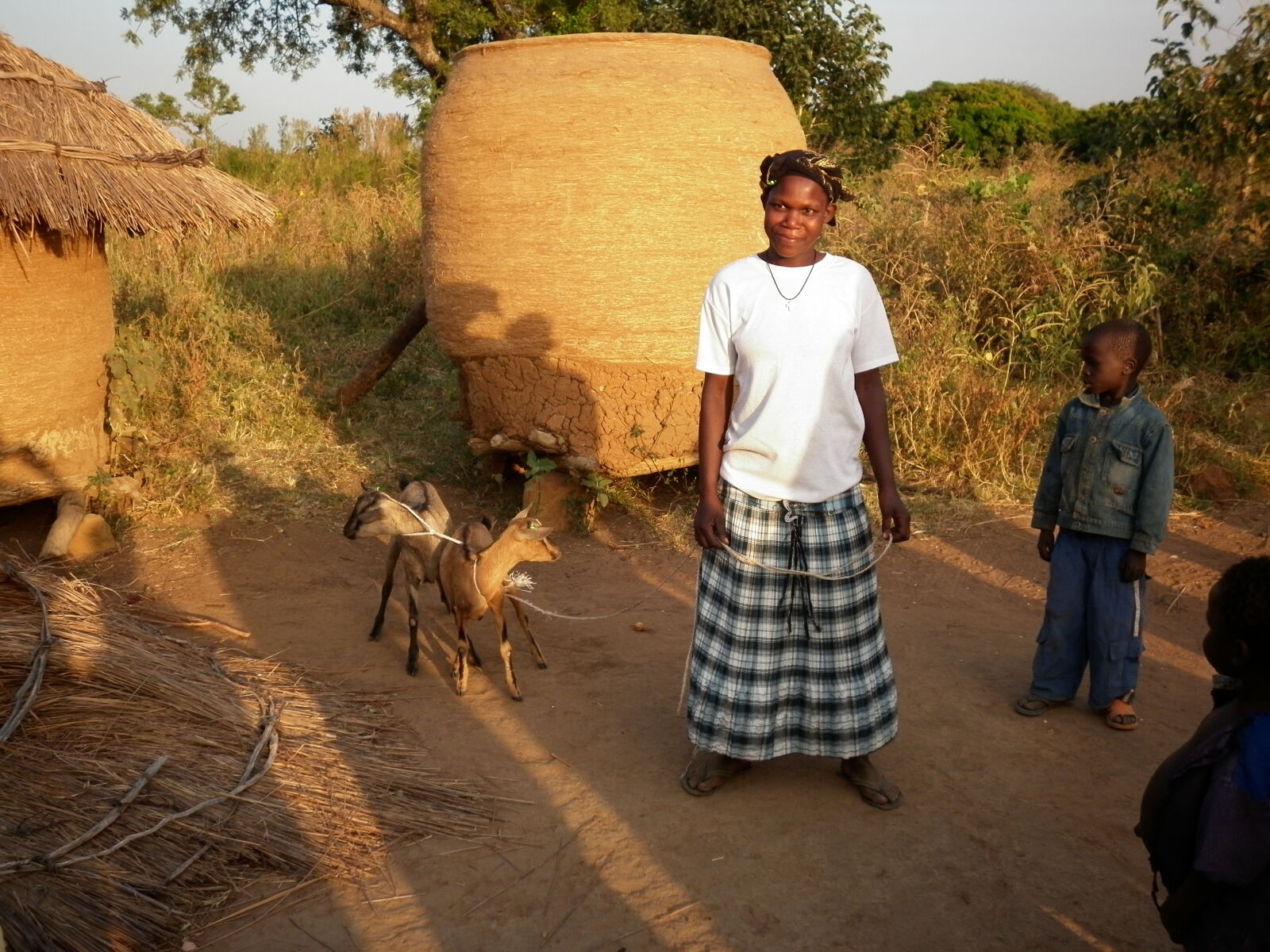 Panasonic DMC-F3 sample photo. Africa, family, goat, poverty photography