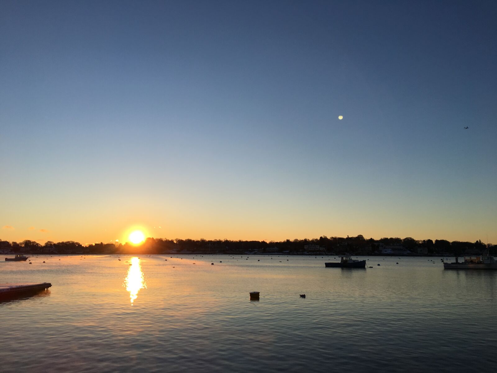 Apple iPhone 6s Plus sample photo. Sunrise, water, boat photography