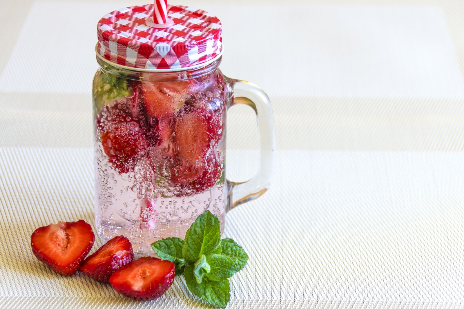 Nikon D3100 sample photo. Mineral water with strawberries photography