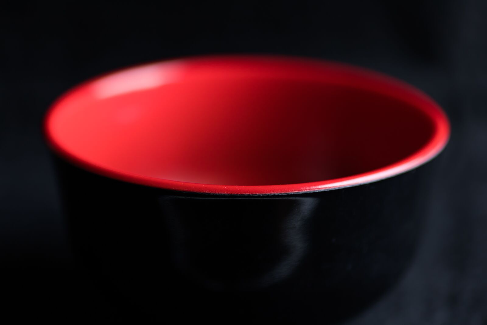 Canon EOS RP sample photo. Black background, bowl, red photography