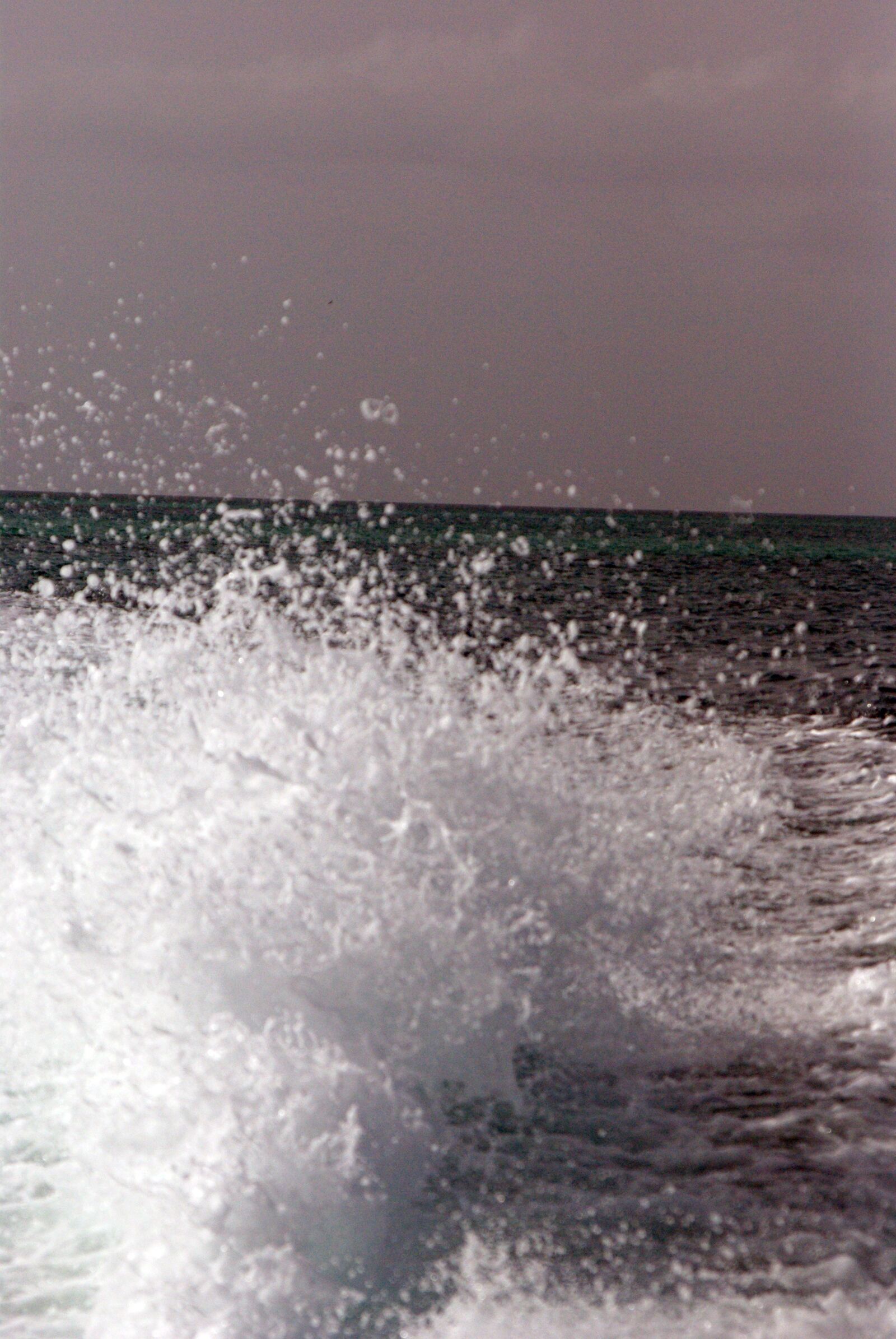 Pentax K10D sample photo. Boat, ocean, surf photography