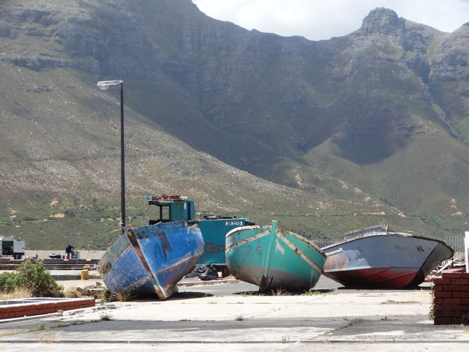 Sony Cyber-shot DSC-HX300 sample photo. Boats, mountain, old photography