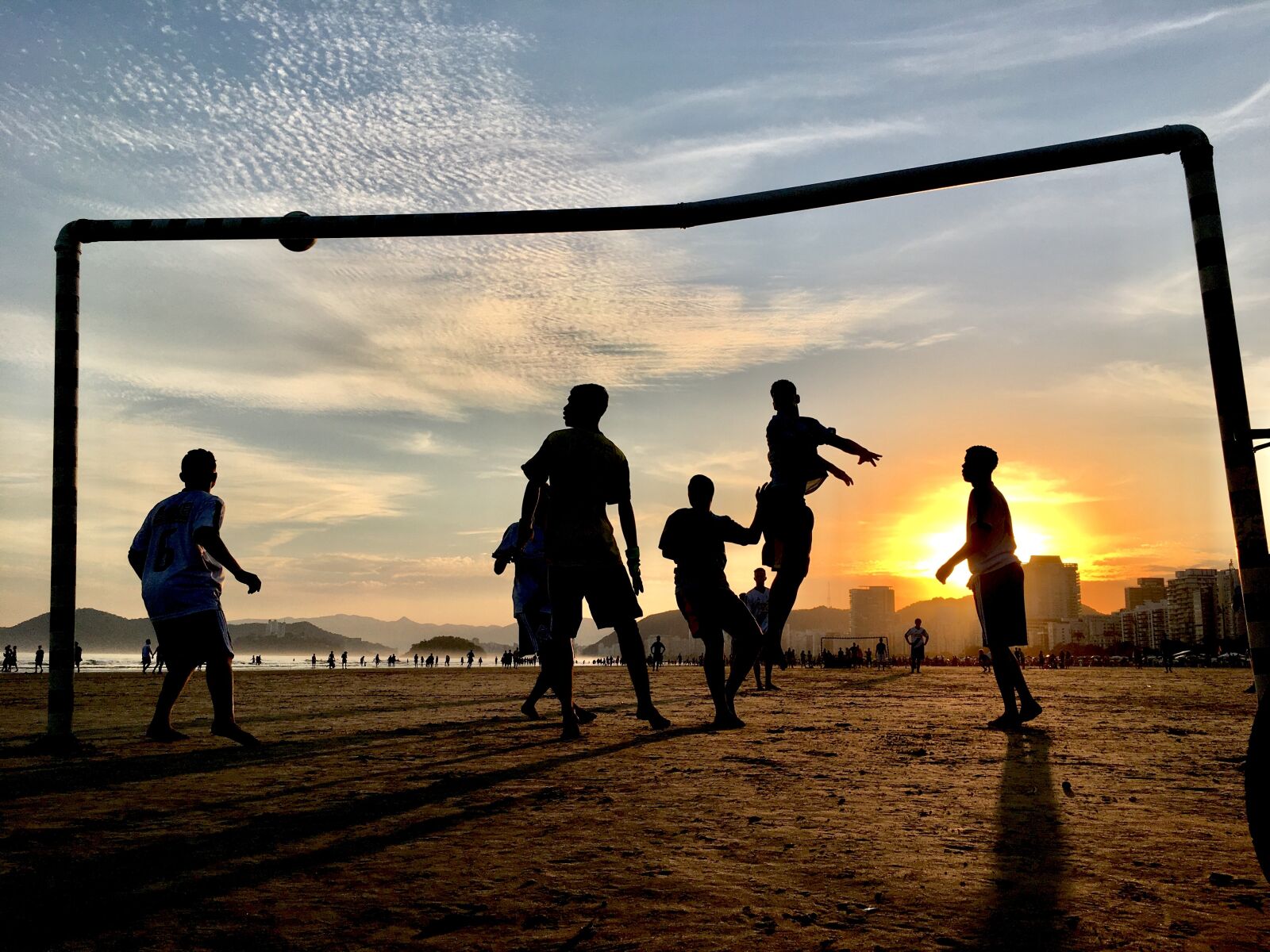 iPhone SE back camera 4.15mm f/2.2 sample photo. Football, beach, summer photography