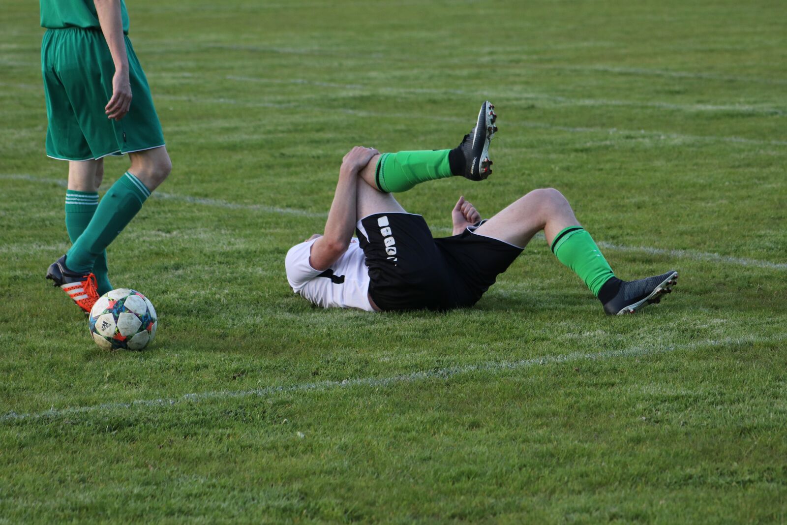 Canon EF75-300mm f/4-5.6 sample photo. Injury, foul, free kick photography