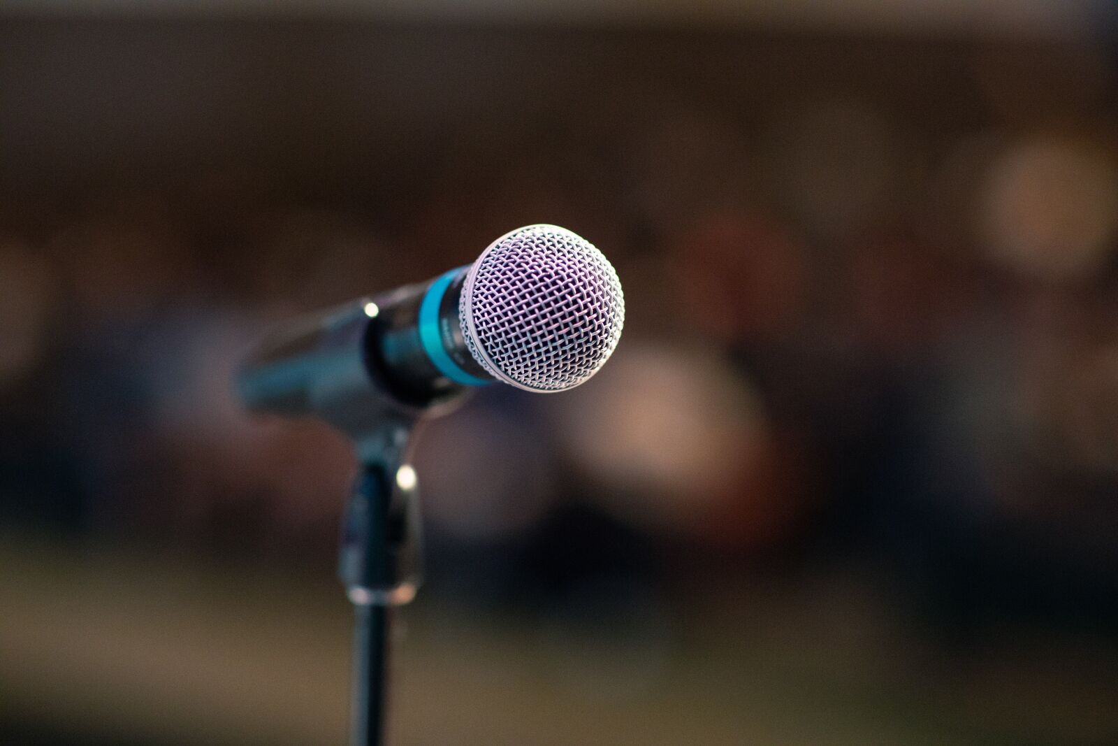Canon EF 85mm F1.2L II USM sample photo. Public speaking, mic, microphone photography