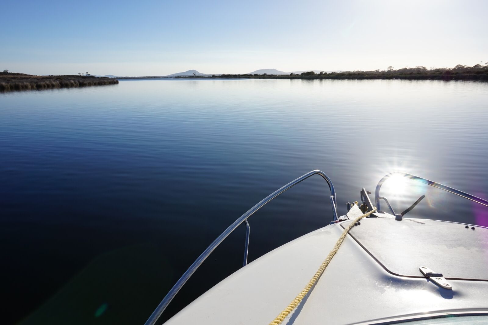 Sony Alpha a5000 (ILCE 5000) sample photo. Boat, still water, lagoon photography