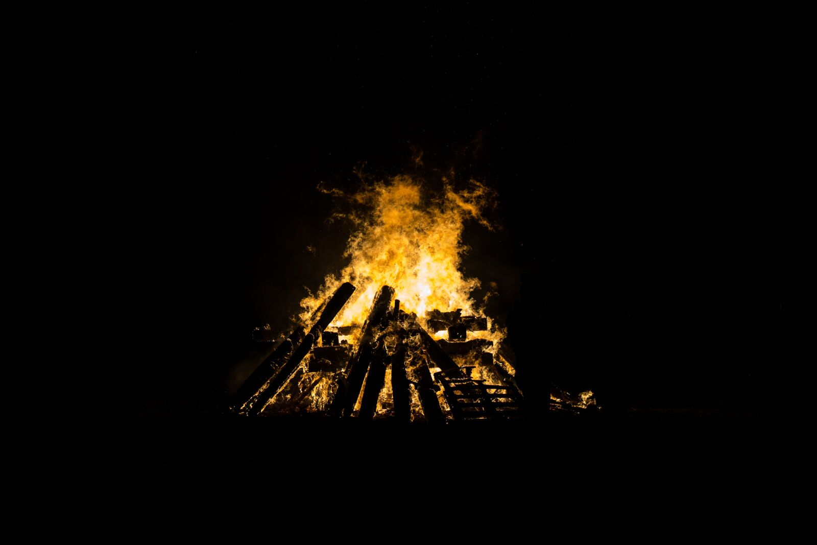 E 50mm F1.8 OSS sample photo. Bonfire, burning, dark photography