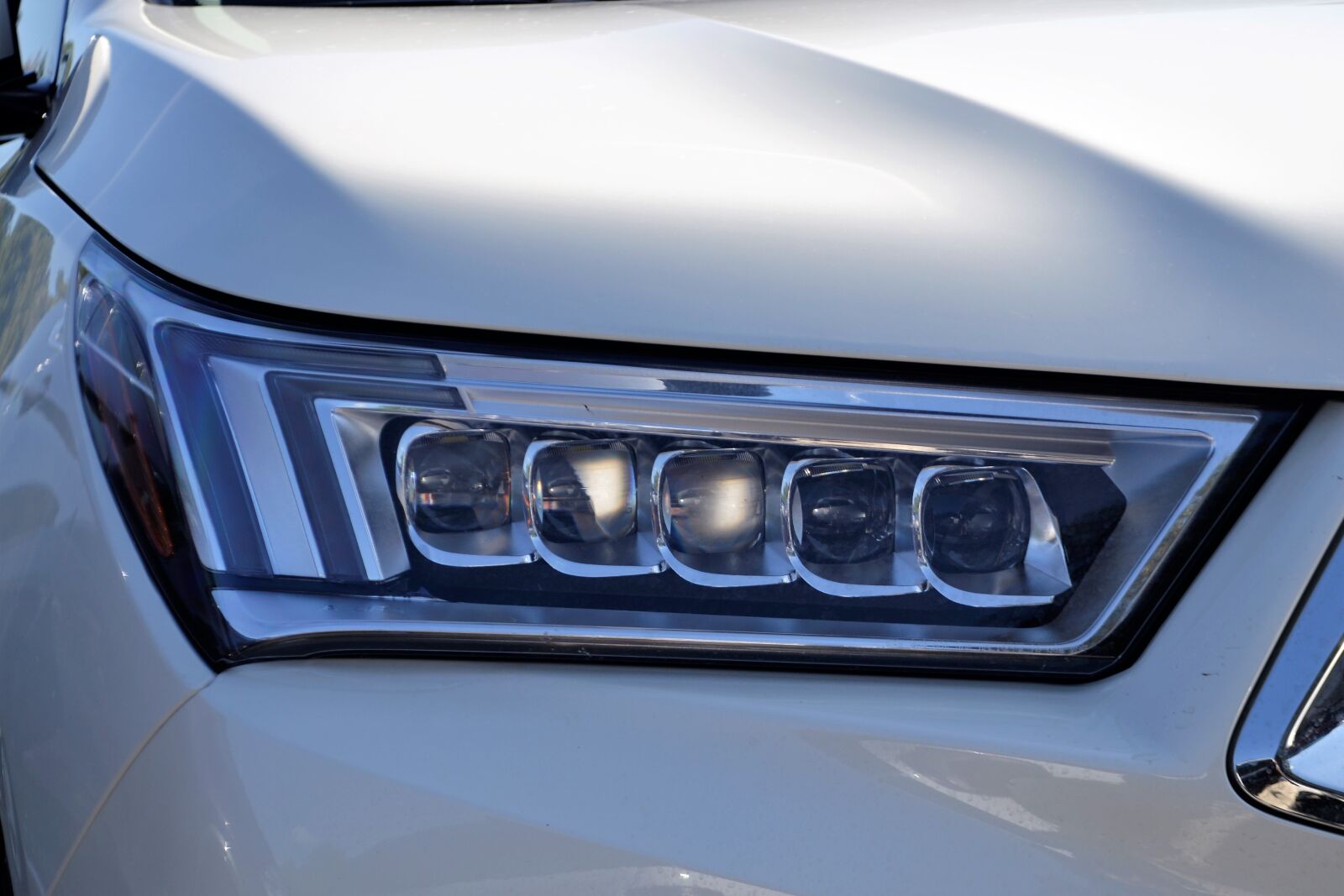 Nikon D3100 sample photo. Acura headlamp, hood, diamond photography