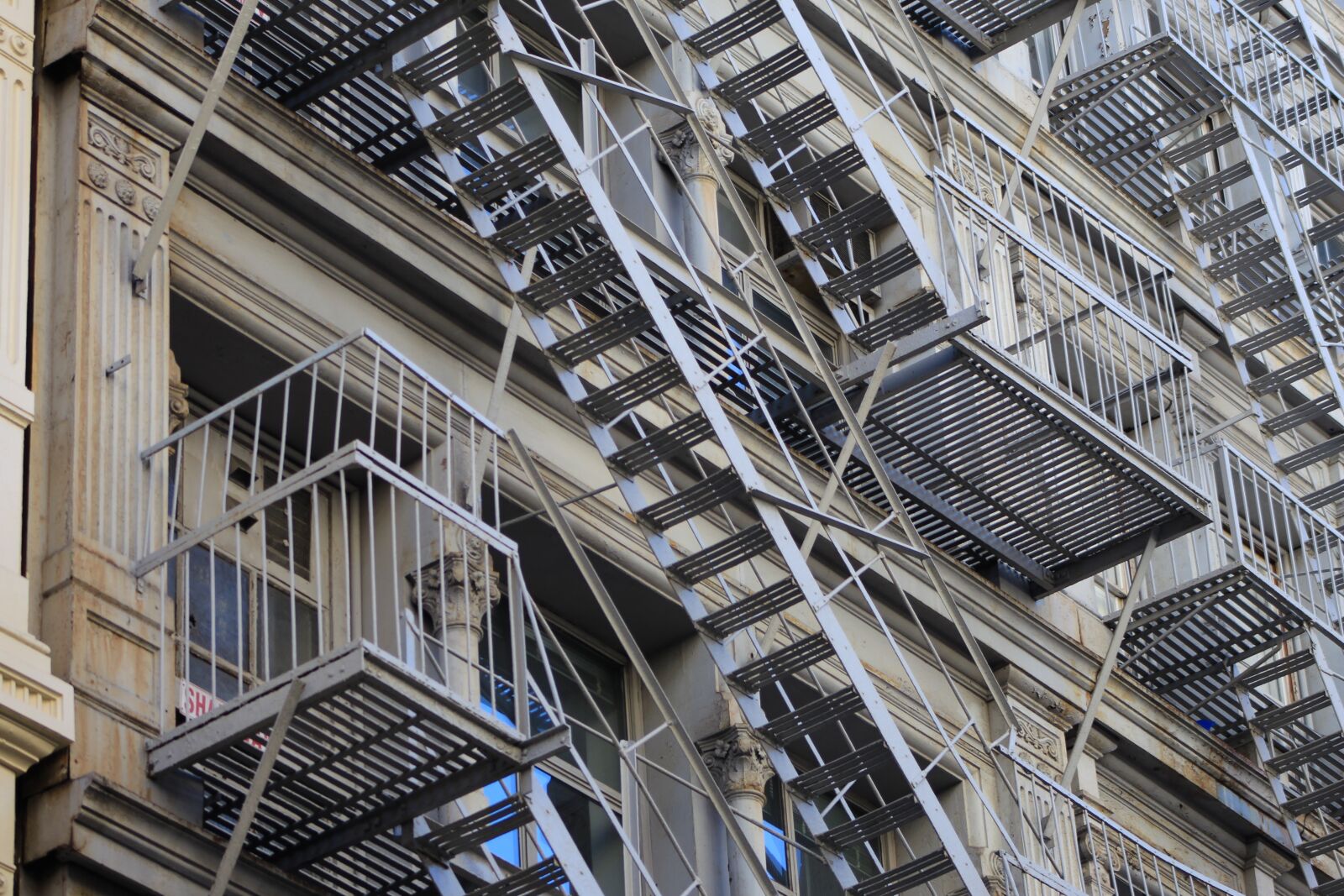 Canon EF 75-300mm f/4-5.6 sample photo. Building, urban, ladder photography