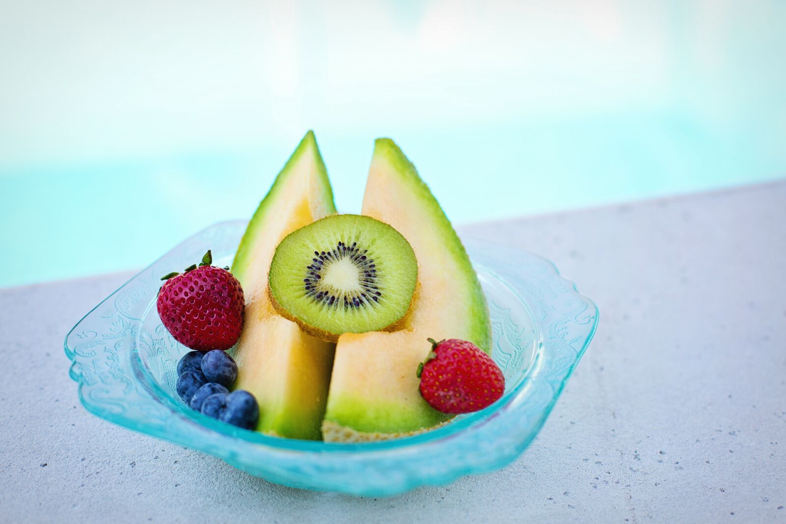 Canon EF 50mm F1.4 USM sample photo. Fruit, bowl, poolside photography