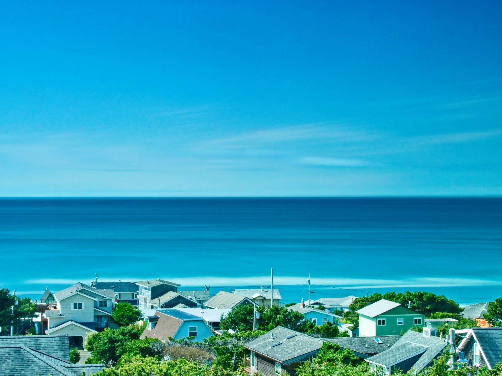 Olympus OM-D E-M1 sample photo. Ocean, houses, sea photography