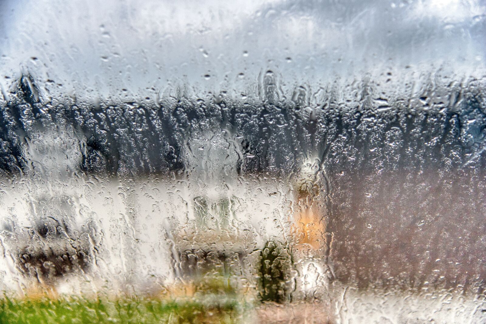 Nikon D750 sample photo. Window pane, rain, blurry photography