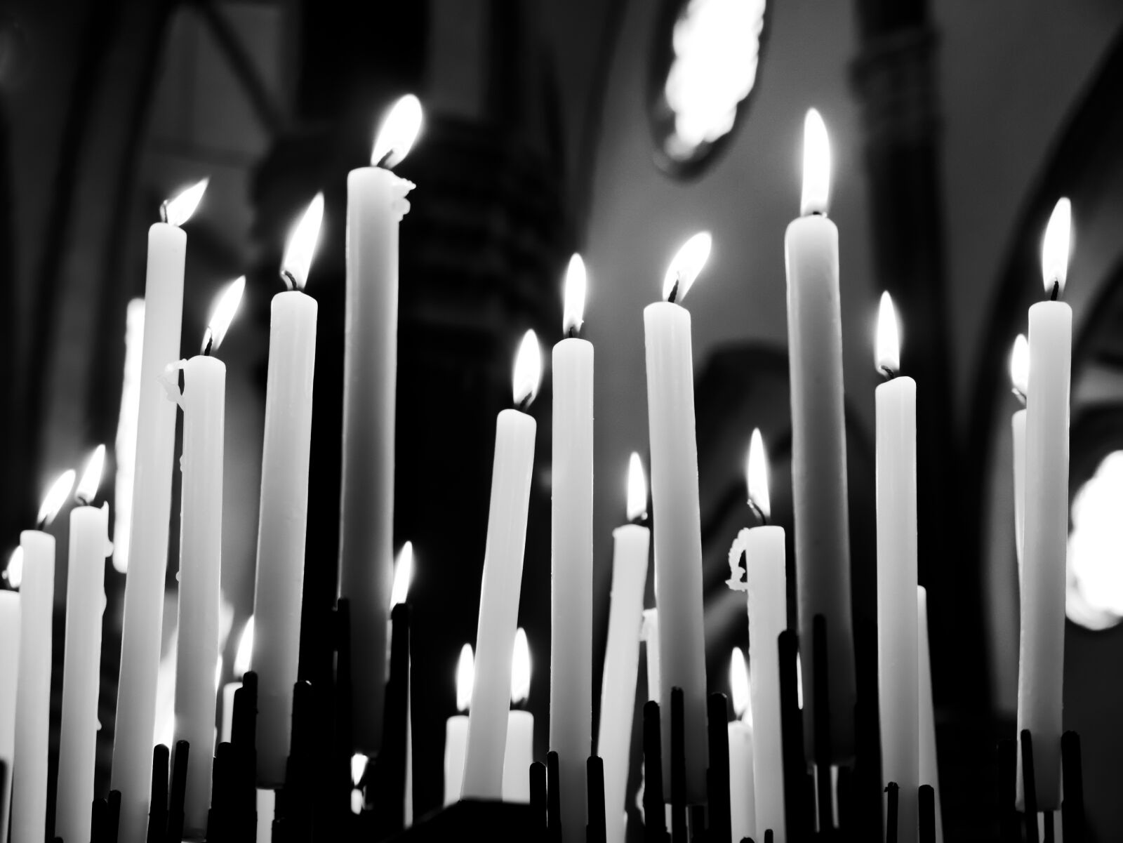Olympus OM-D E-M10 sample photo. Candles, prayers, black and photography