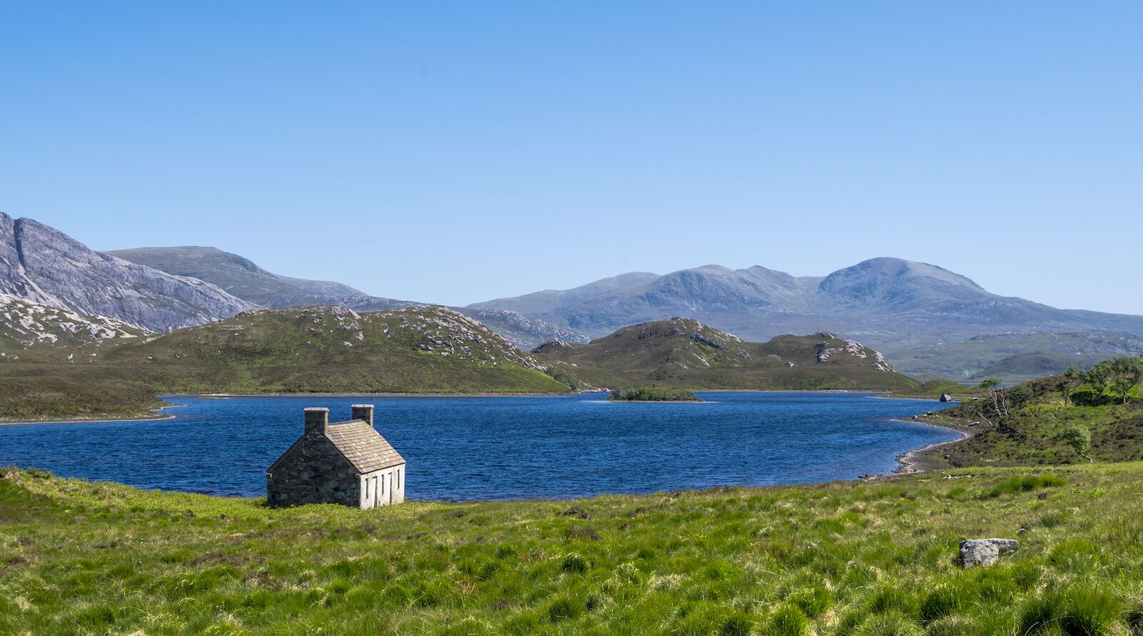Pentax K-50 sample photo. Hole stack, hut, lake photography