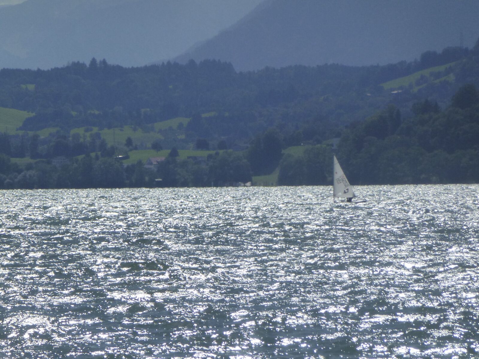 Panasonic Lumix DMC-ZS10 (Lumix DMC-TZ20 / Lumix DMC-TZ22) sample photo. Lake, sailing vessel, landscape photography
