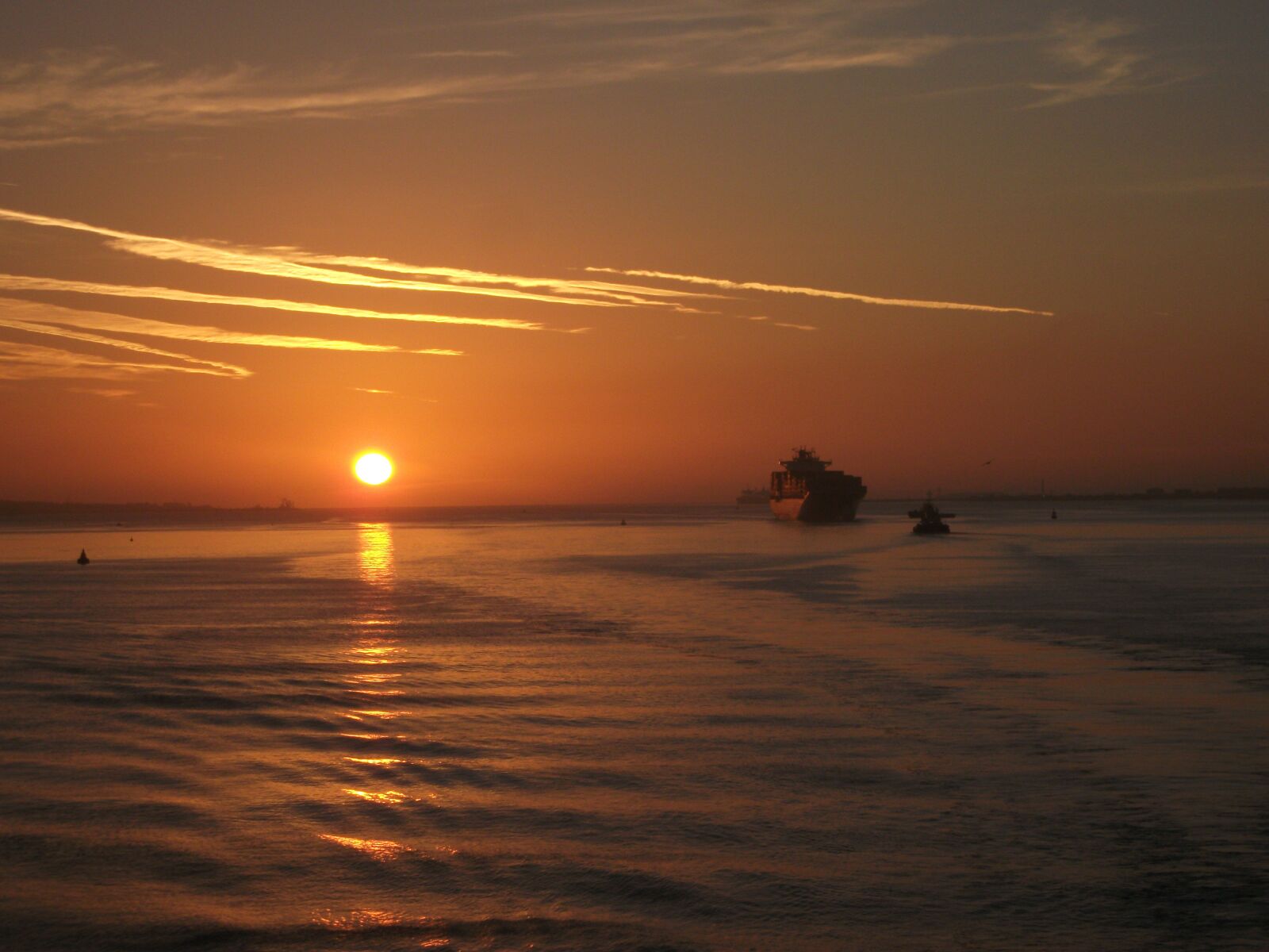 Fujifilm A235 sample photo. Sunrise over water, ships photography