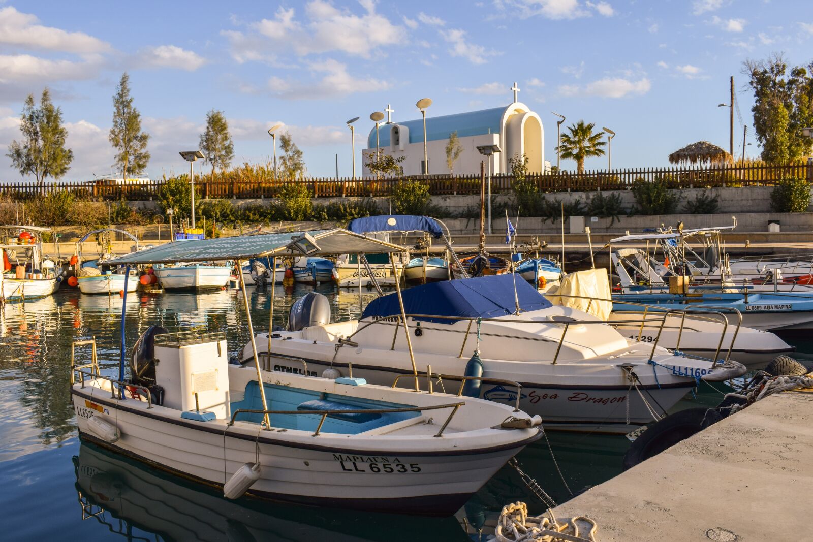 Nikon D3300 sample photo. Fishing harbor, boats, church photography