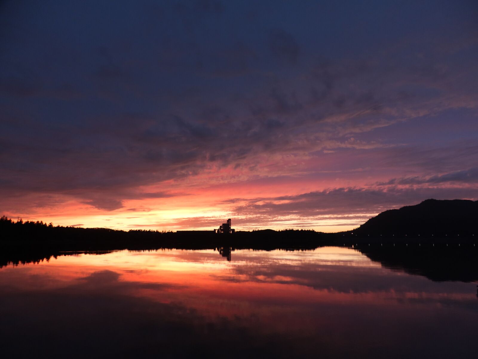 Canon XC10 sample photo. Seascape, sunset, silo photography