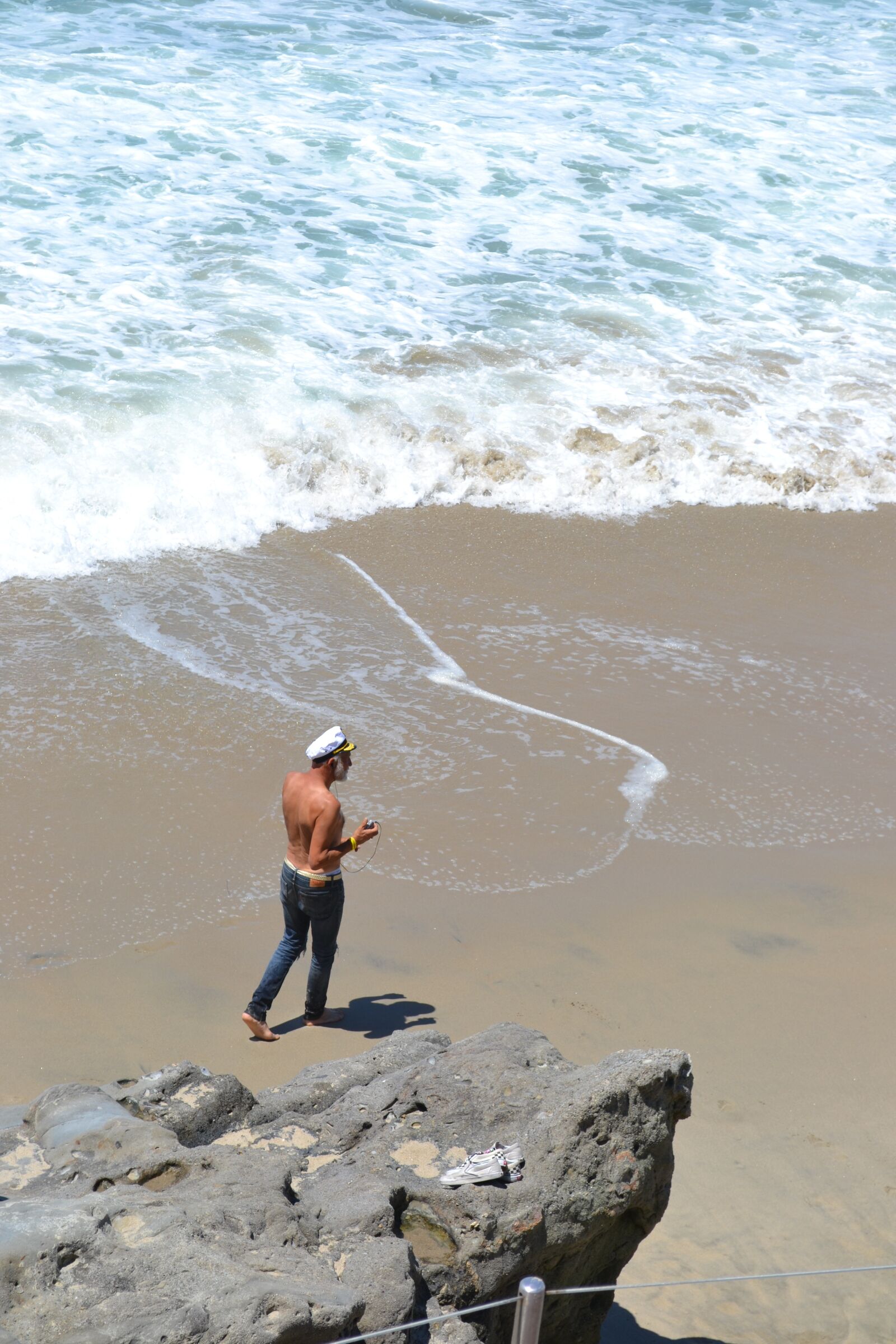 Nikon D3100 sample photo. Sailor on beach, beach photography