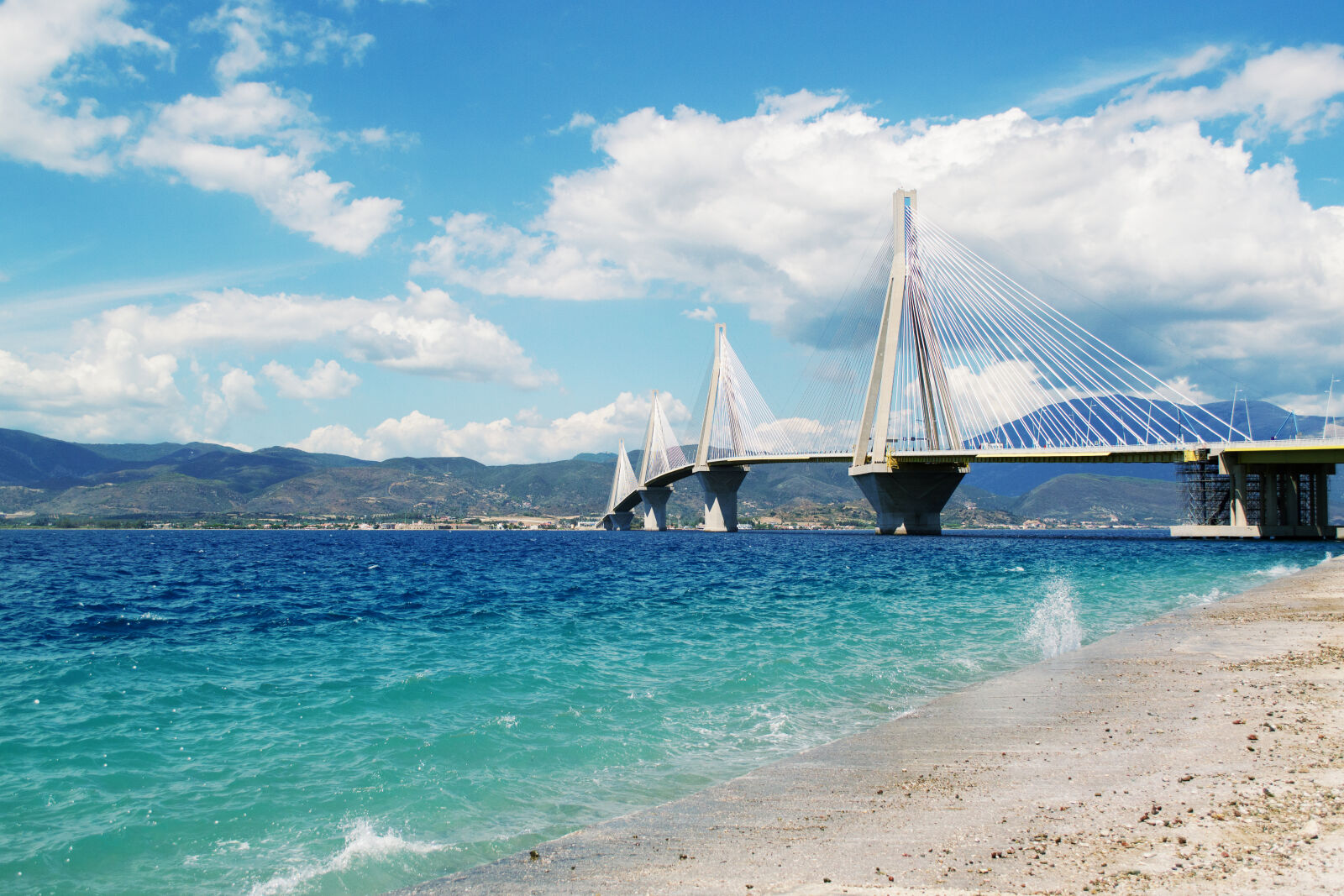 Nikon D3100 sample photo. Beach, blue, sky, bridge photography