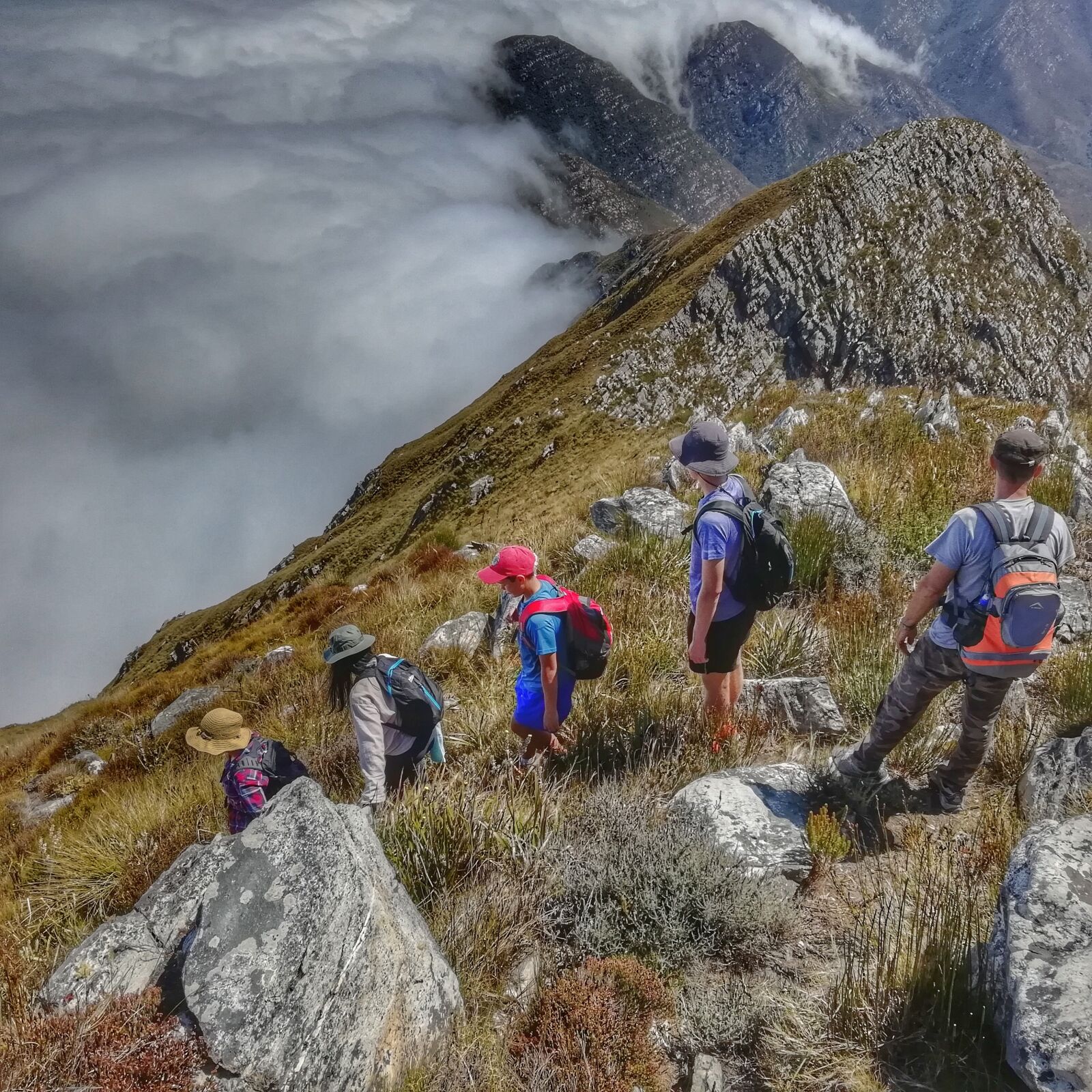 HUAWEI FIG-LX1 sample photo. Hikers, clouds, mountains photography