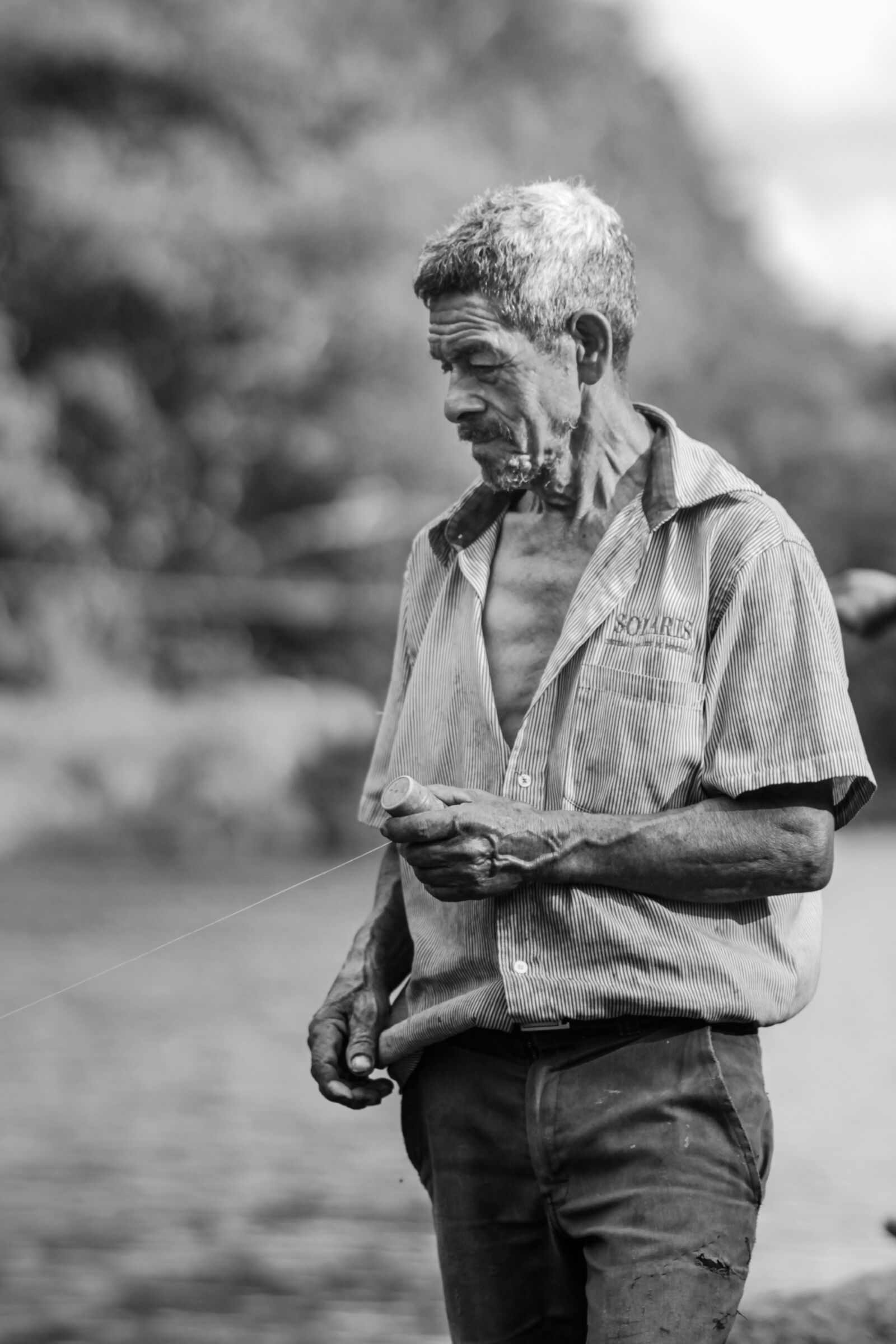 Canon YN85mm f/1.8 DCM sample photo. Fisherman, elder, age photography