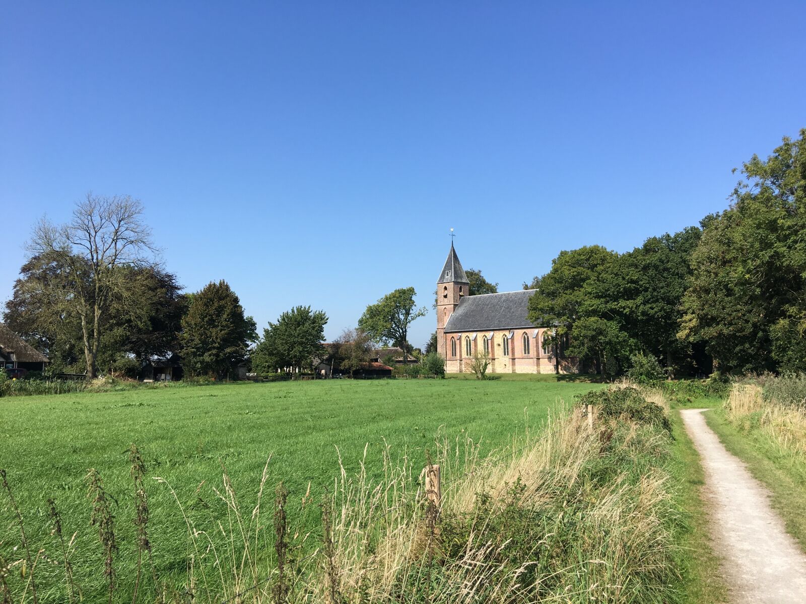Apple iPhone 6s Plus sample photo. Ruinerwold, church, fields photography