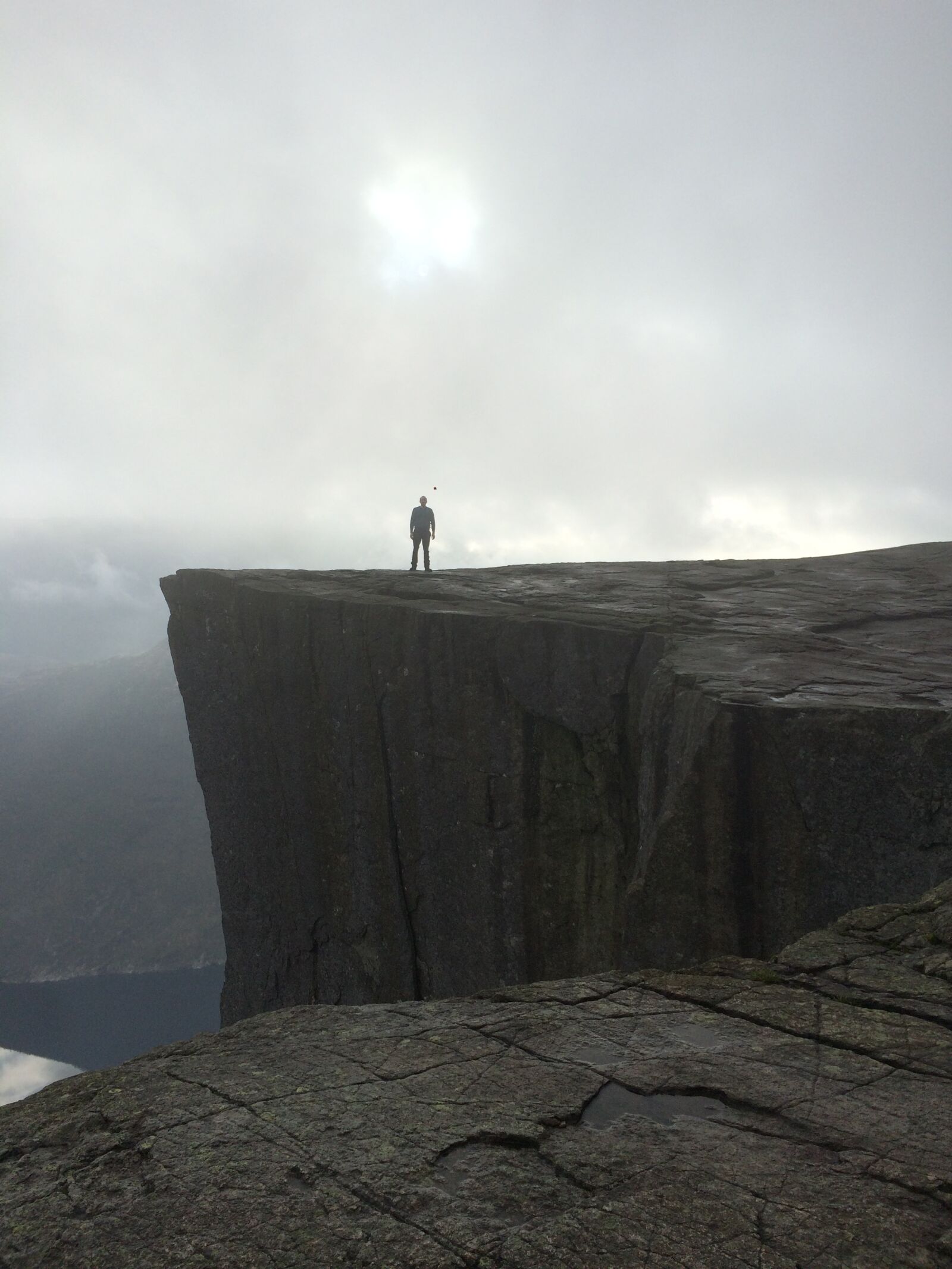 iPhone 5s back camera 4.15mm f/2.2 sample photo. Cliff, top, hiker, mountain photography