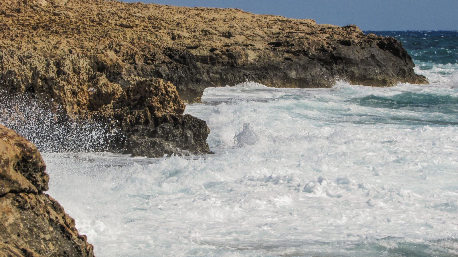 Canon PowerShot SX400 IS sample photo. Rocky coast, waves, splashing photography