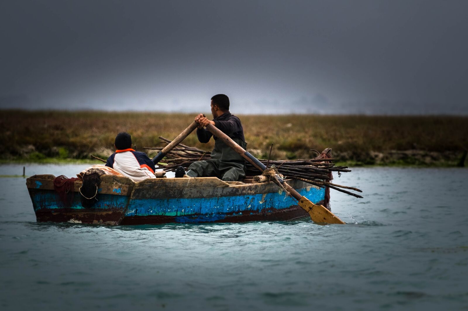 Fujifilm XF 50-140mm F2.8 R LM OIS WR sample photo. Boat, fisherman, water photography