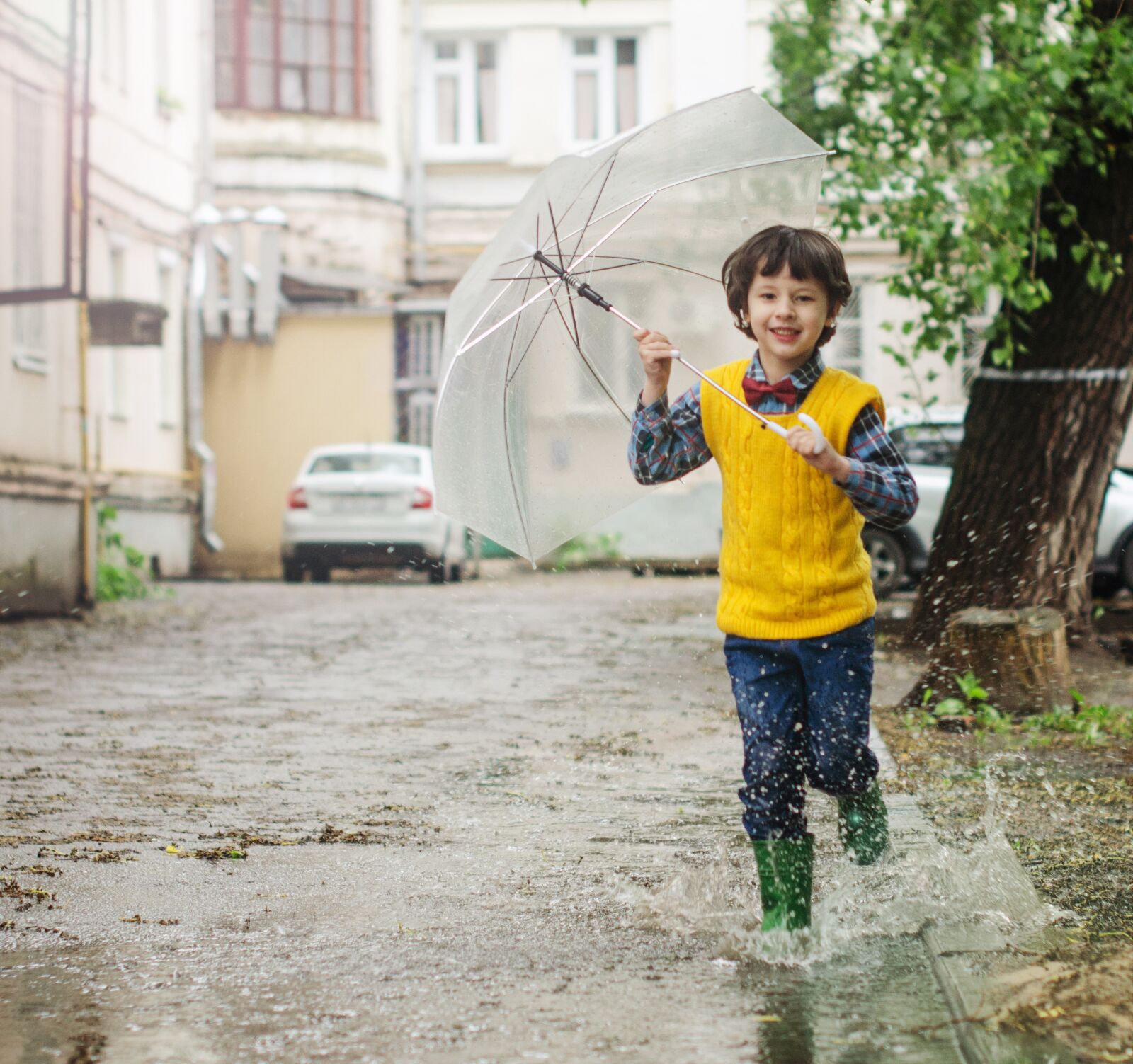 Nikon D5100 sample photo. Umbrella, puddle, kid photography