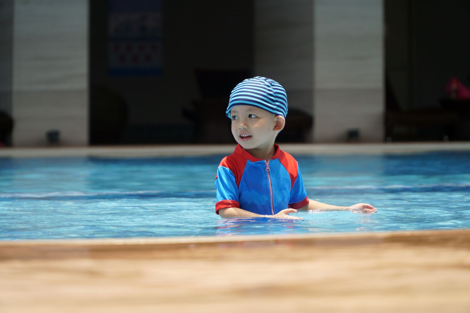 Sony a6400 + Sony E PZ 18-105mm F4 G OSS sample photo. Baby swimming suit, baby photography