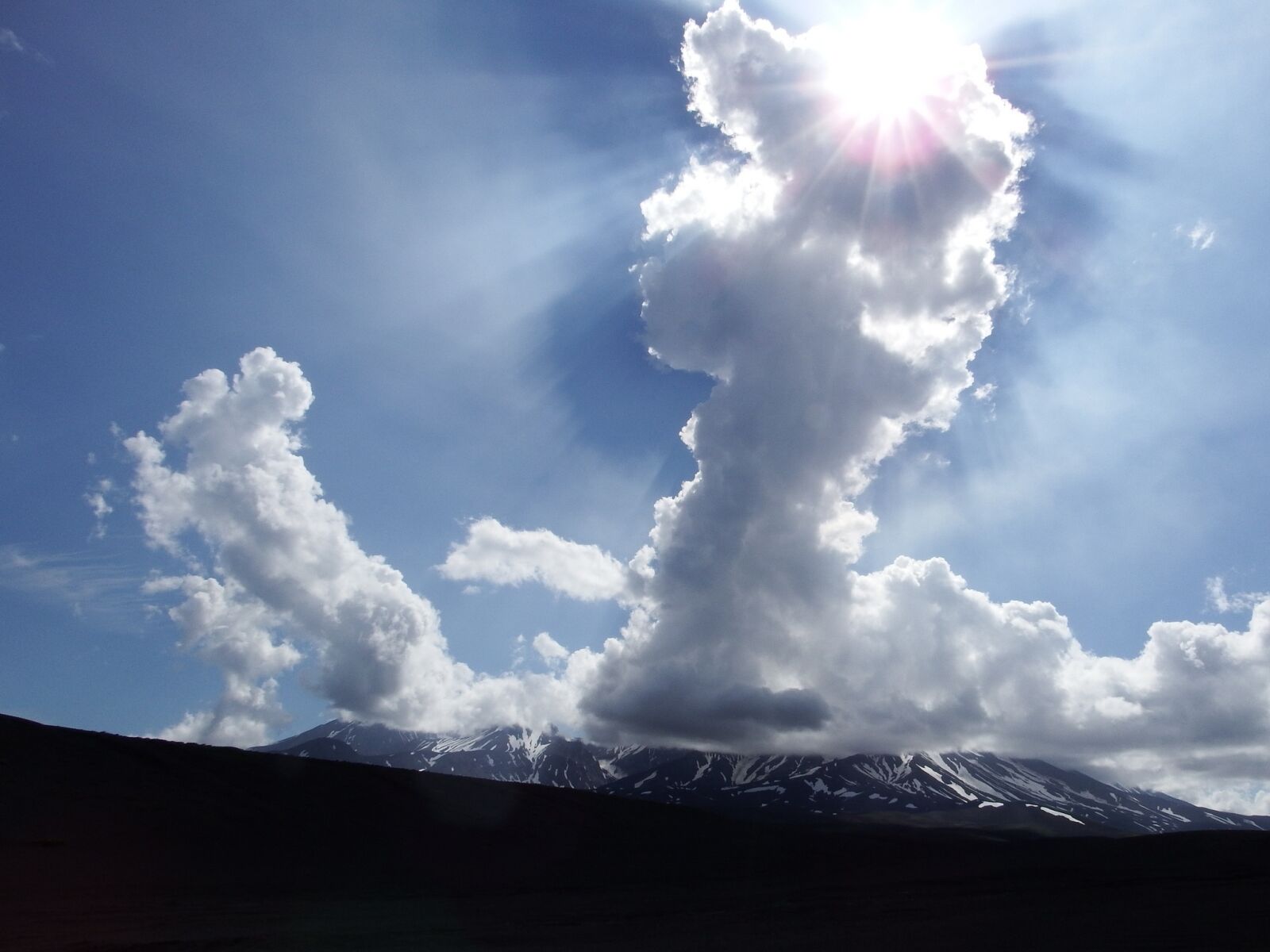 Fujifilm FinePix S1 sample photo. Cloud, sun, sky photography