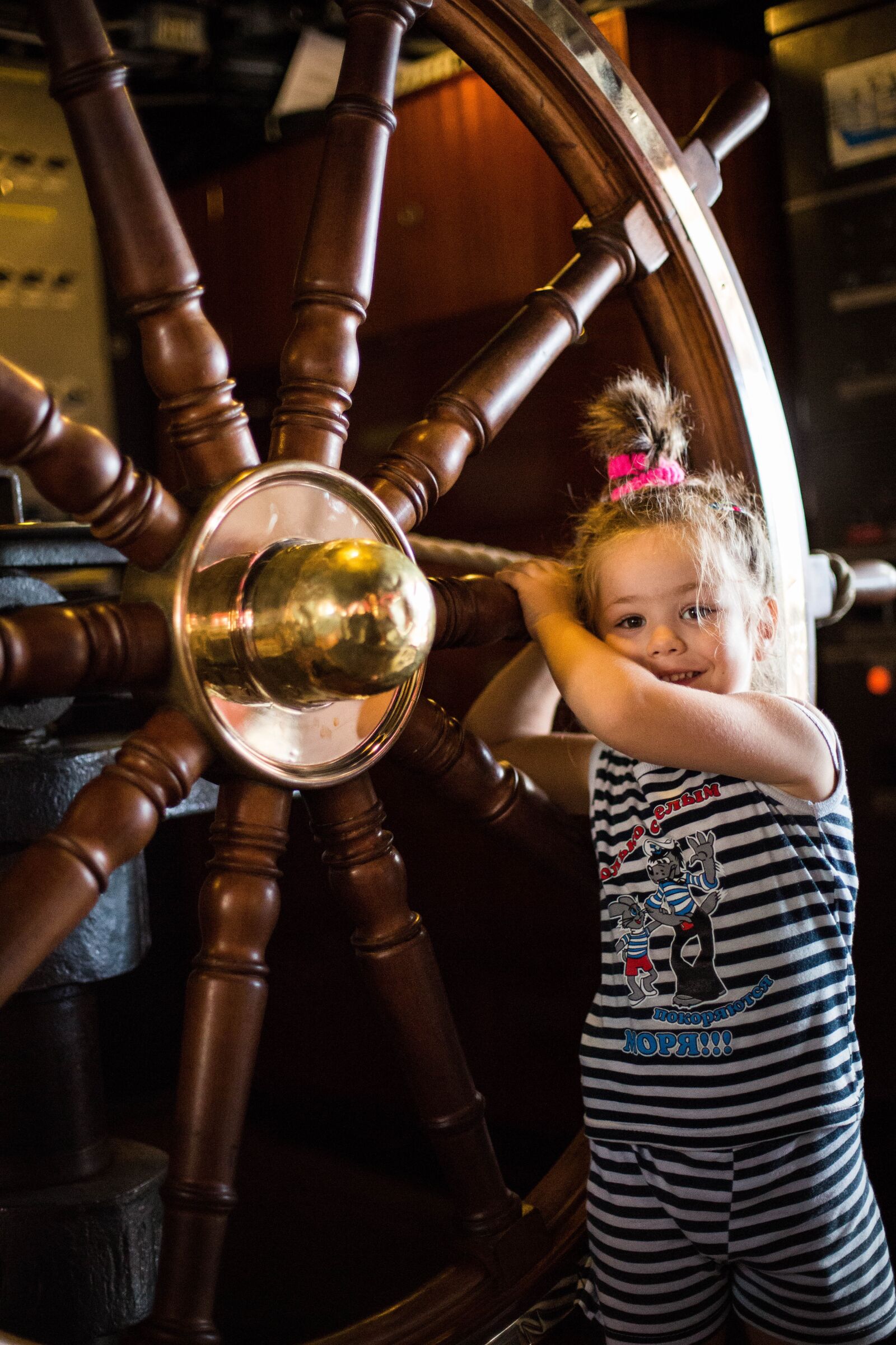 Canon EF 50mm F1.4 USM sample photo. Ship wheel, young girl photography