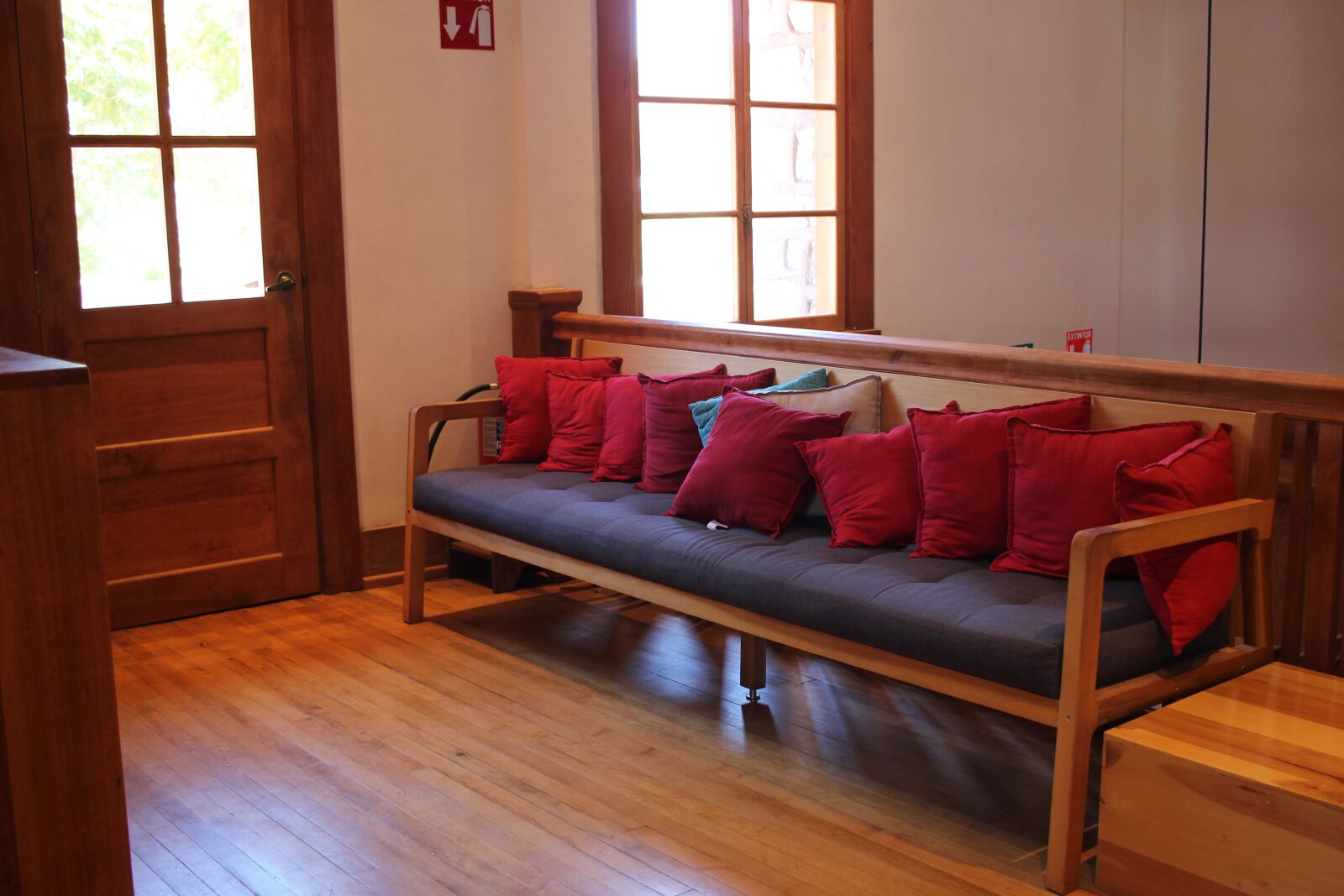 Canon EF-S 24mm F2.8 STM sample photo. Armchair, cushions, library photography