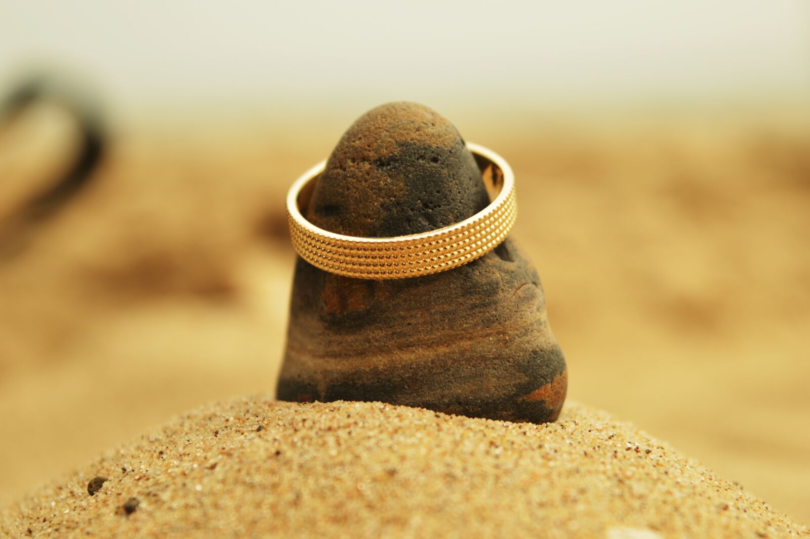 Nikon D3200 sample photo. Stone, ring, sand photography