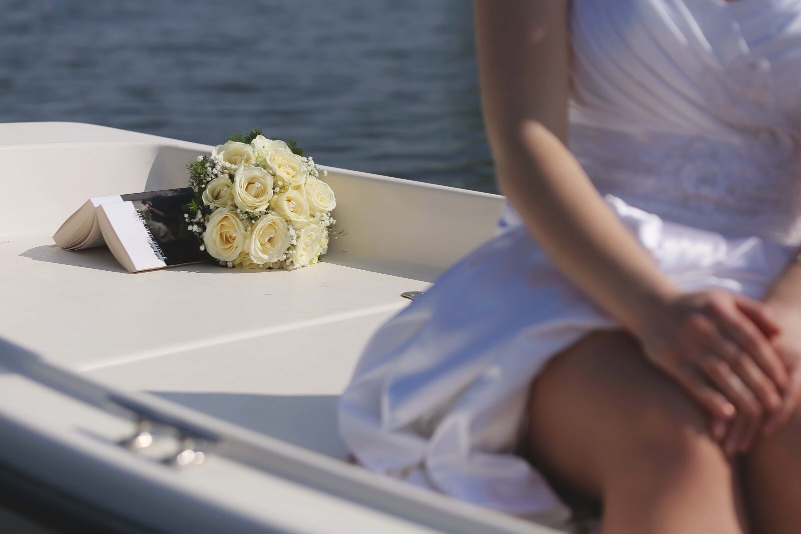 Canon EF 70-200mm F2.8L IS USM sample photo. Boat, book, hands, handsome photography