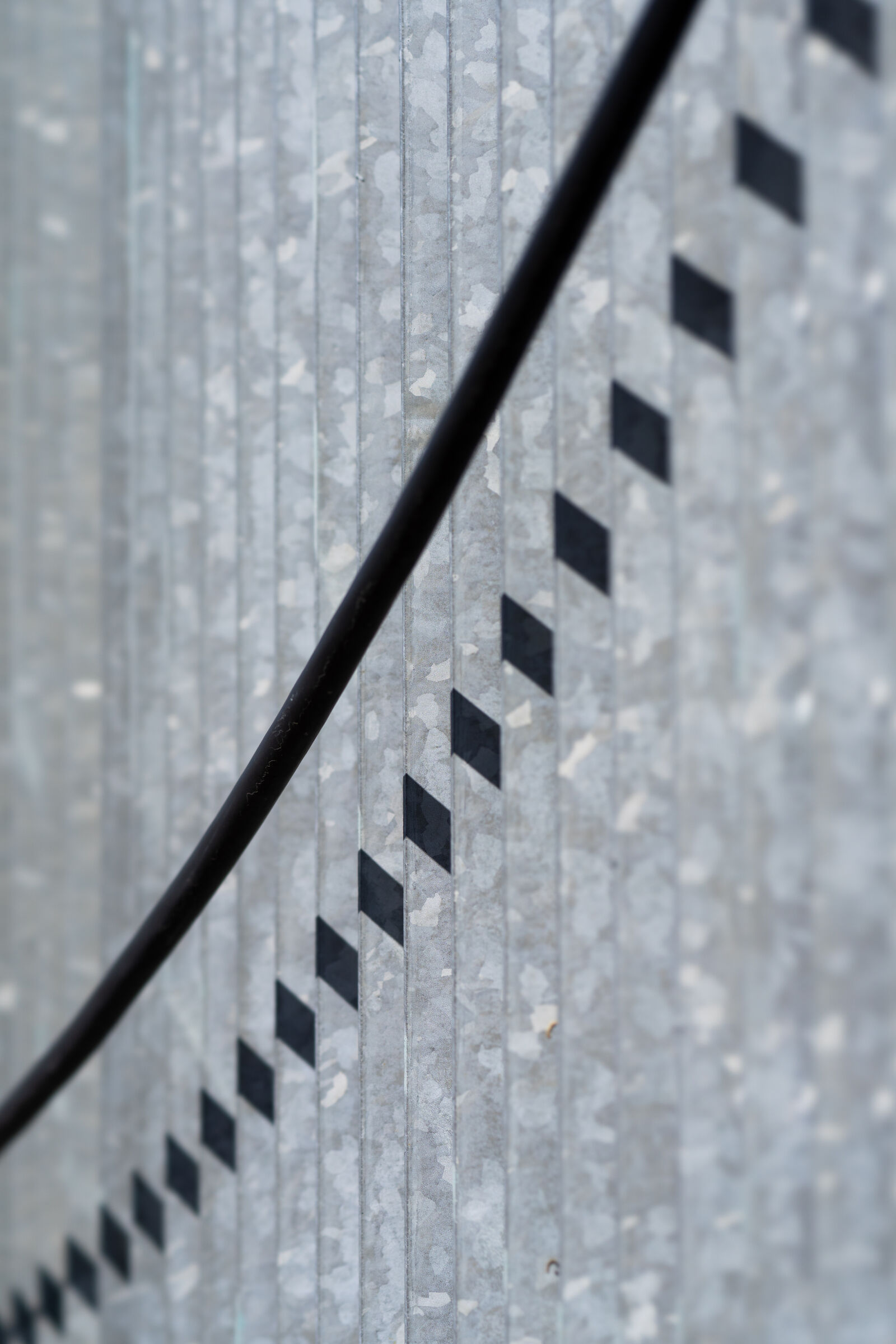 Sony FE 100mm F2.8 STF GM OSS sample photo. Abstract metal fence photography