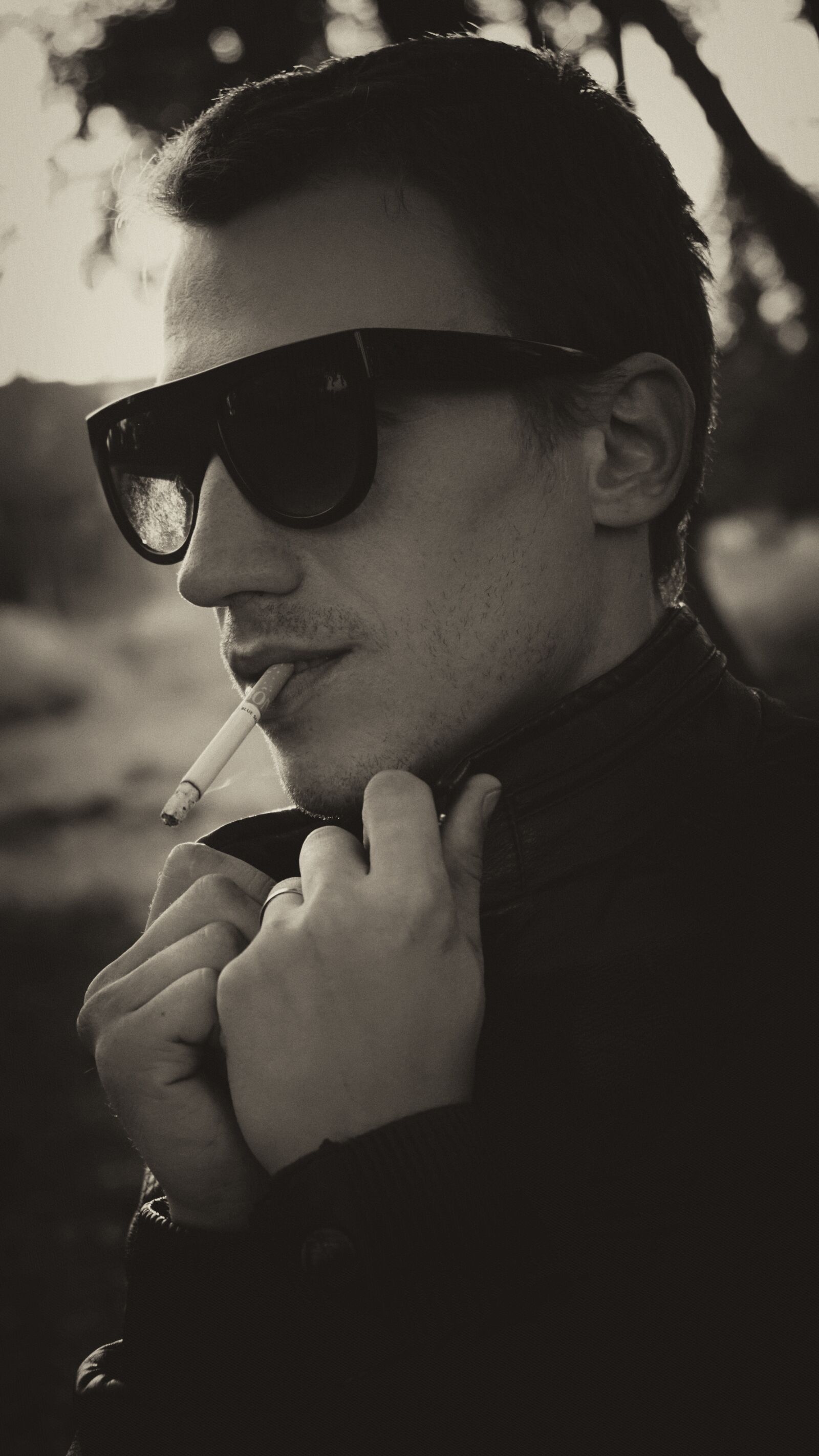 Sony a6000 + Sony Vario-Tessar T* E 16-70mm F4 ZA OSS sample photo. Glasses, cigarette, smoking photography