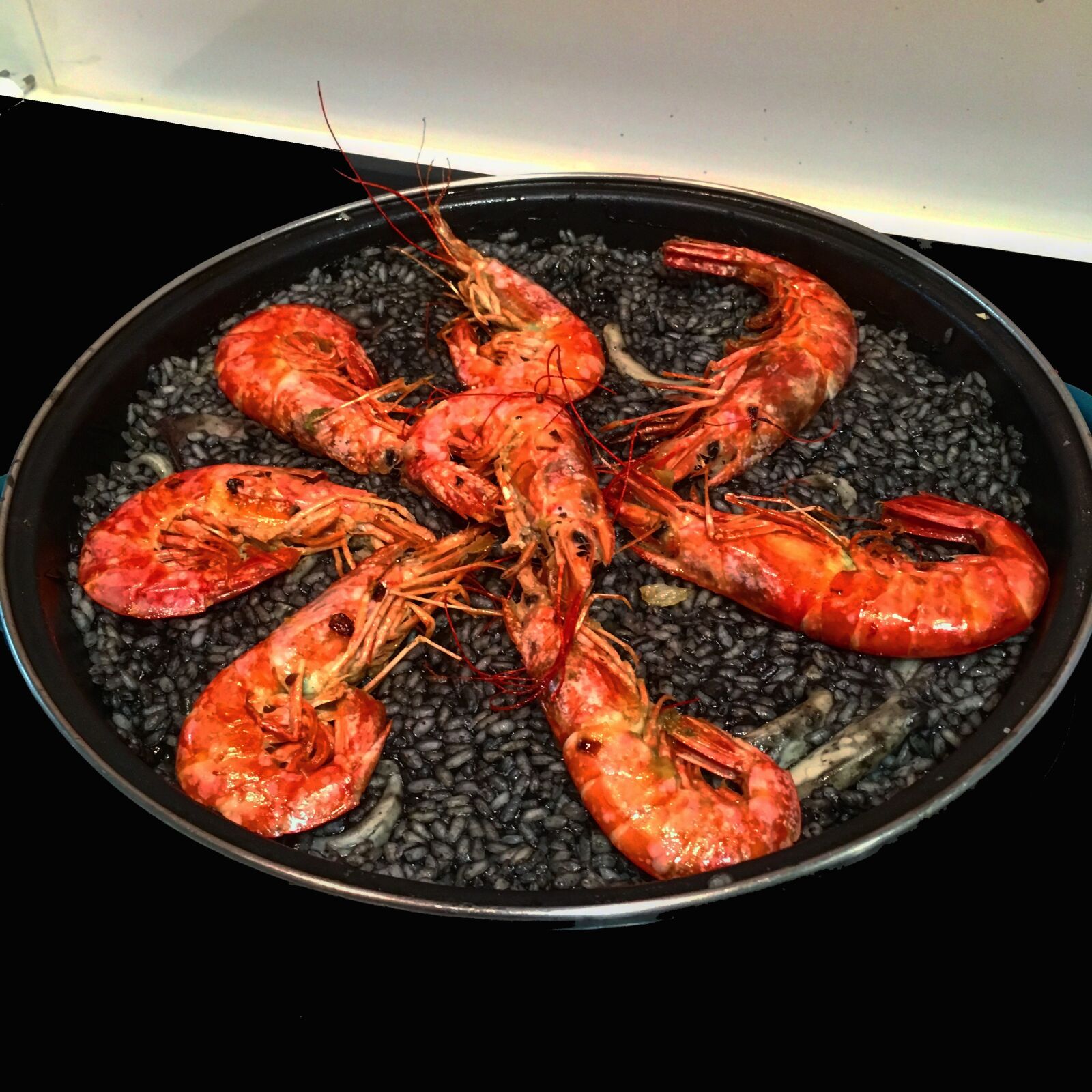 iPhone SE back camera 4.15mm f/2.2 sample photo. Paella, black rice, food photography