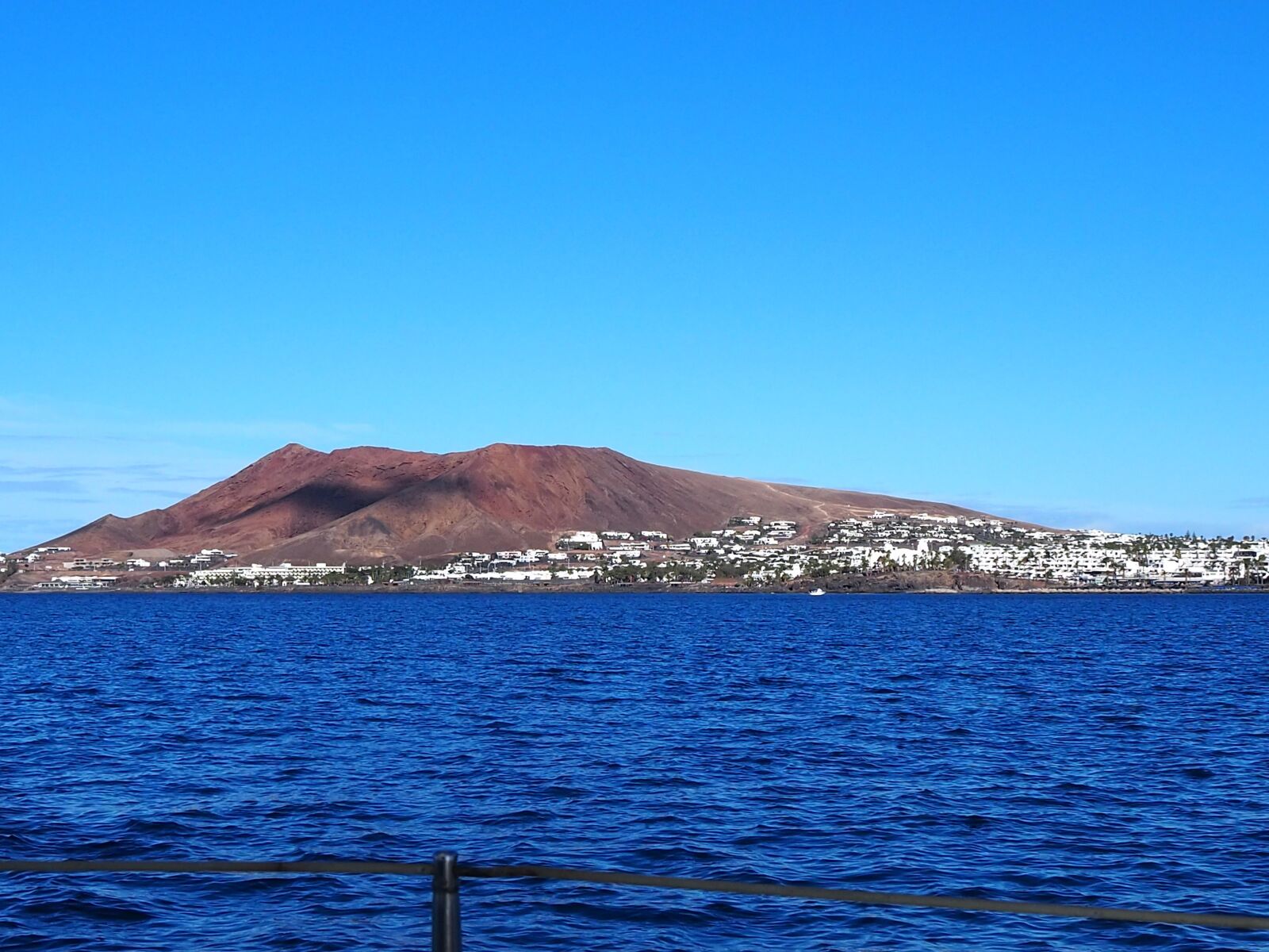 Olympus PEN E-PL9 sample photo. Lanzarote, sailboat, deck chair photography