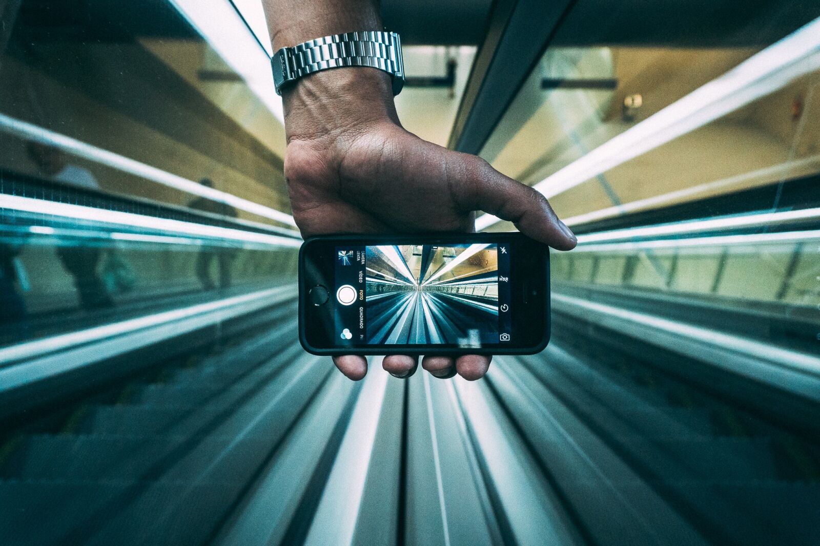 Sony a6300 sample photo. Escalators, hand, iphone photography