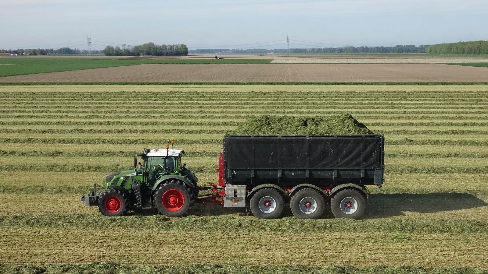 Sony Cyber-shot DSC-RX10 III sample photo. Tractor, grass, mow photography
