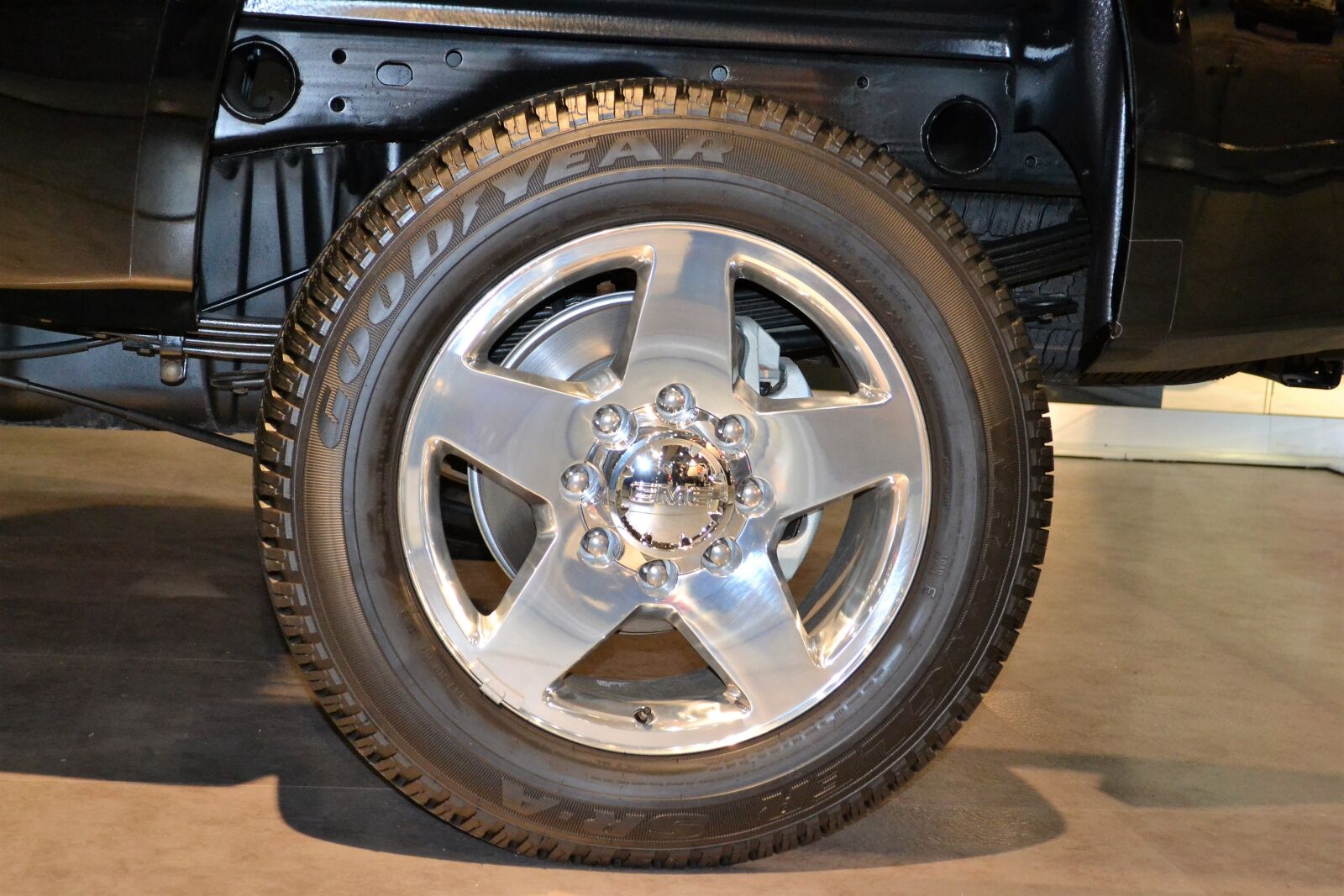 Nikon D3100 sample photo. Suv rear tire, goodyear photography