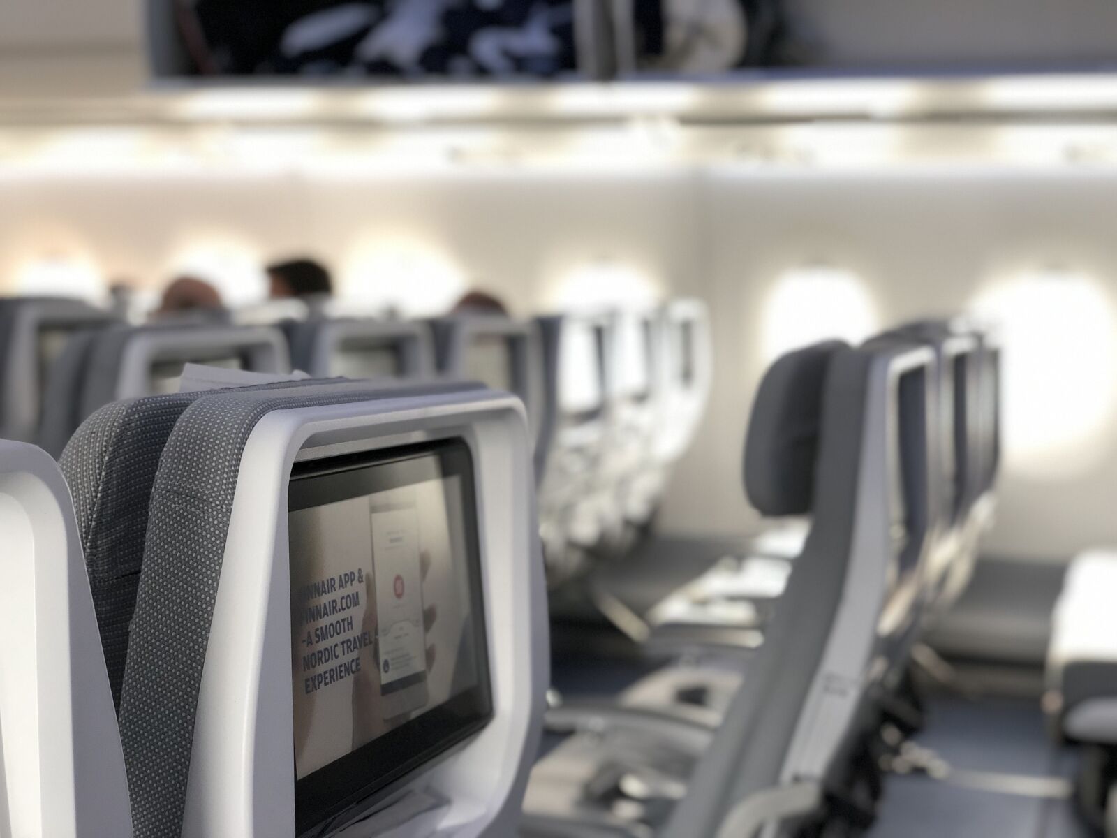 iPhone X back dual camera 6mm f/2.4 sample photo. Airplane, seats, in photography