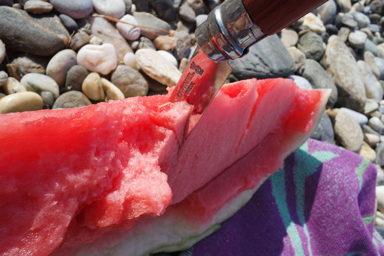 Samsung NX mini sample photo. Knife, rocks, stones, watermelon photography